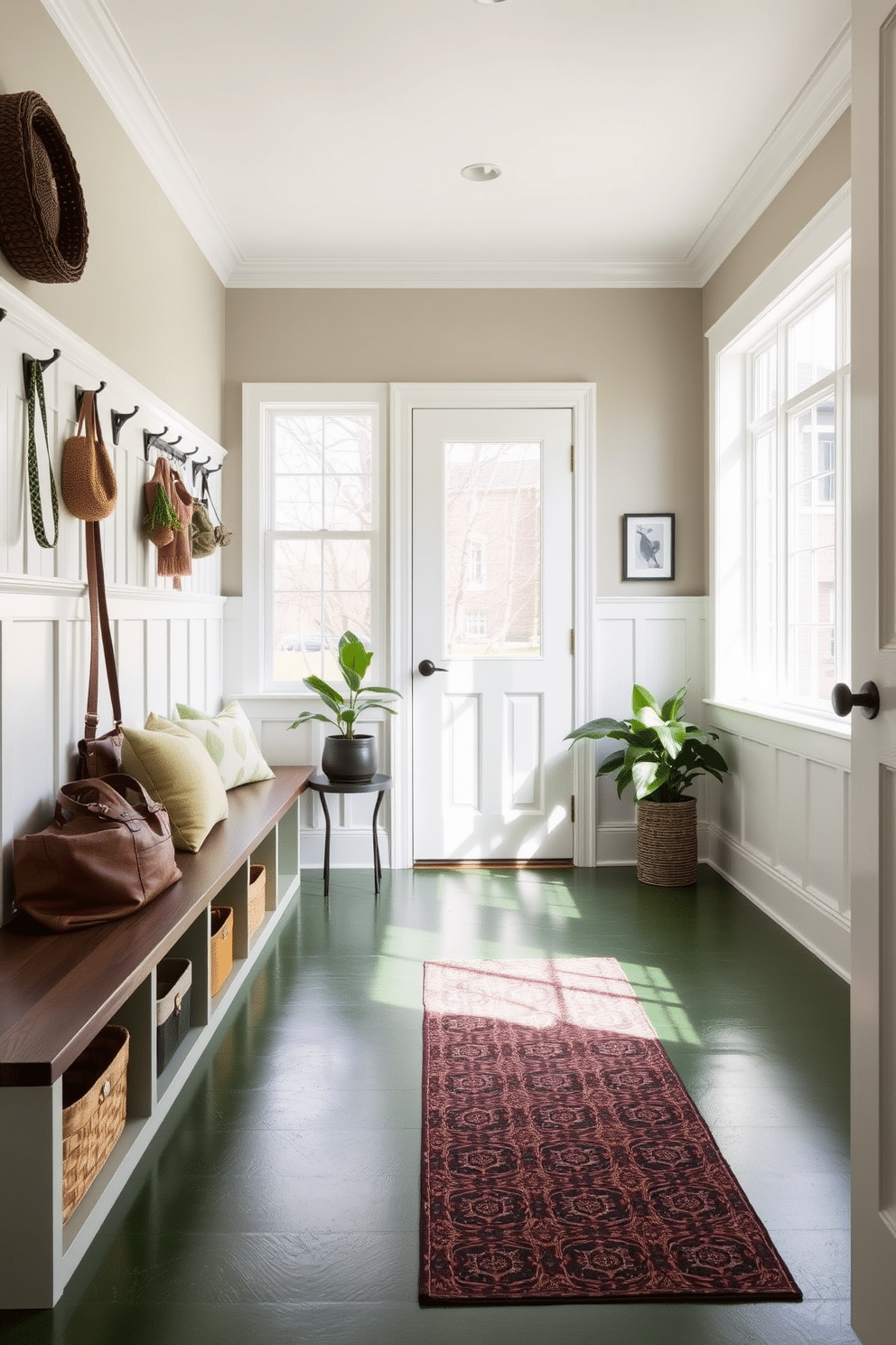 A split-level mudroom features green flooring that adds depth and visual interest, creating a welcoming transition space. The design incorporates built-in benches with storage underneath, and the walls are adorned with hooks for coats and bags, enhancing functionality. Natural light floods the area through large windows, illuminating the earthy tones of the decor. Potted plants are strategically placed to bring a touch of nature indoors, complementing the green flooring and creating a refreshing atmosphere.