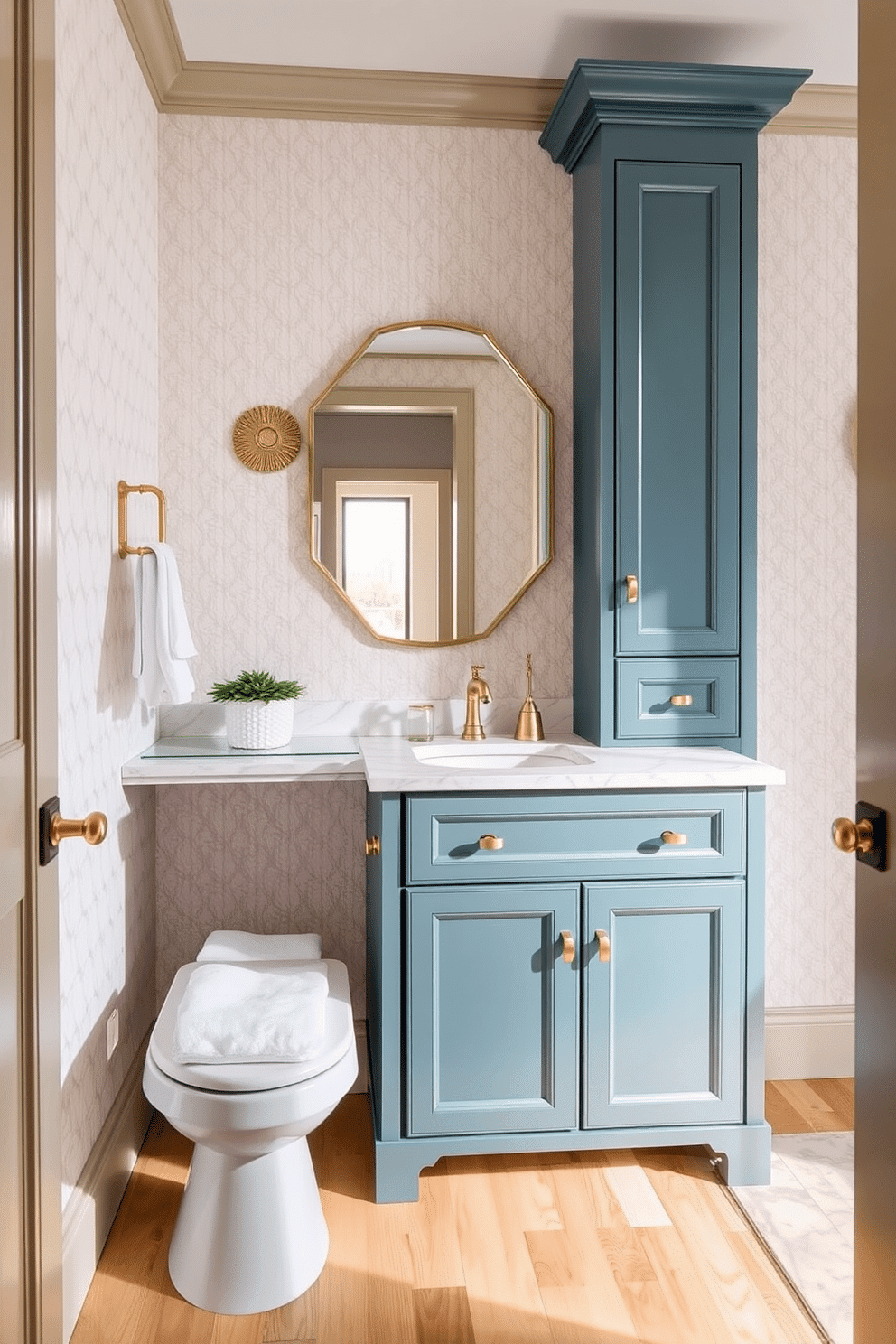 A stylish powder room featuring a teal vanity with a sleek marble countertop, complemented by elegant gold fixtures. The walls are adorned with a soft, neutral wallpaper, and the floor is finished with light-colored hardwood for a warm contrast.