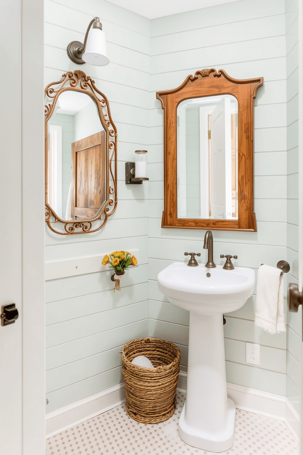 A charming powder room featuring pale green shiplap walls that evoke a rustic ambiance. The space is adorned with a vintage wooden mirror and a sleek white pedestal sink, complemented by natural wood accents throughout.