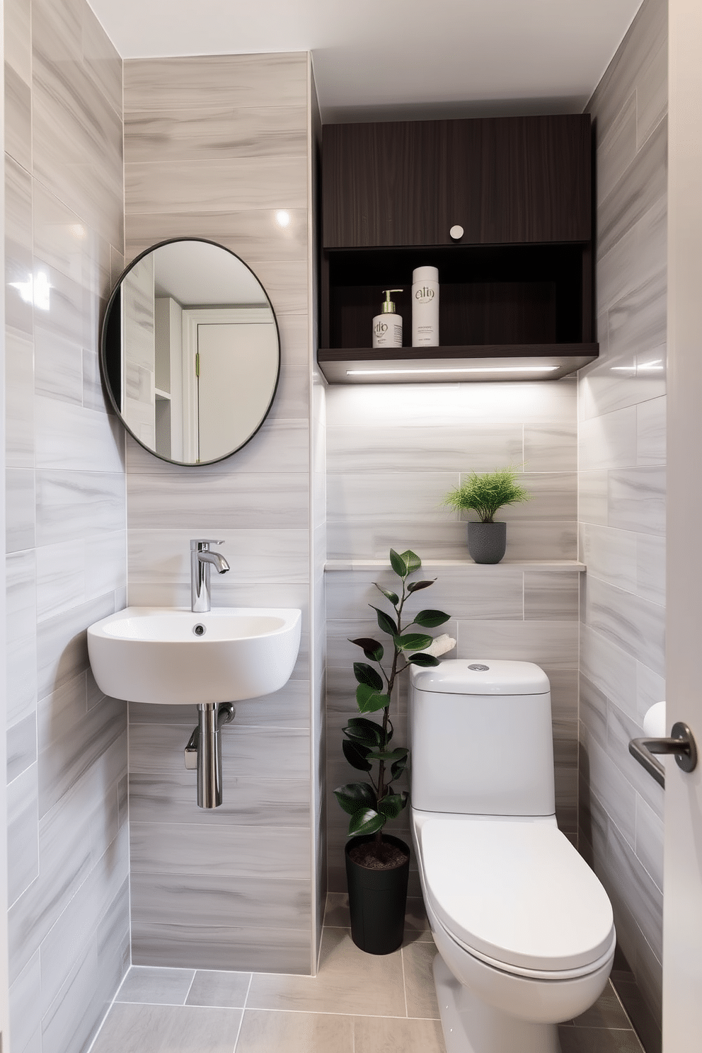 A stylish half bath featuring compact furniture for efficient use. The design includes a sleek wall-mounted sink with a minimalist faucet, accompanied by a floating shelf for toiletries. The walls are adorned with light gray tiles that create an illusion of space, while a small round mirror reflects the natural light. A compact, modern toilet is positioned beside a decorative plant, adding a touch of greenery to the space.