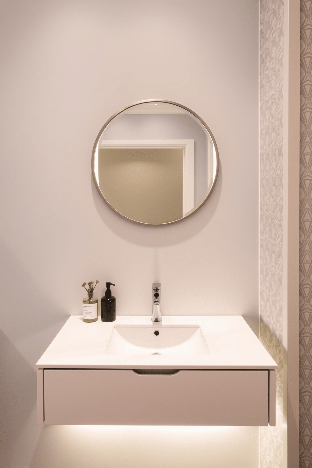 A sleek floating vanity is mounted against a soft gray wall, featuring a white quartz countertop that seamlessly integrates with the minimalist design. Below the vanity, LED strip lighting creates a warm ambiance, highlighting the clean lines and modern aesthetic. The half bath is accented with geometric patterned wallpaper in subtle tones, adding depth and interest to the space. A round mirror with a brushed nickel frame hangs above the vanity, reflecting the stylish fixtures and enhancing the overall contemporary feel.