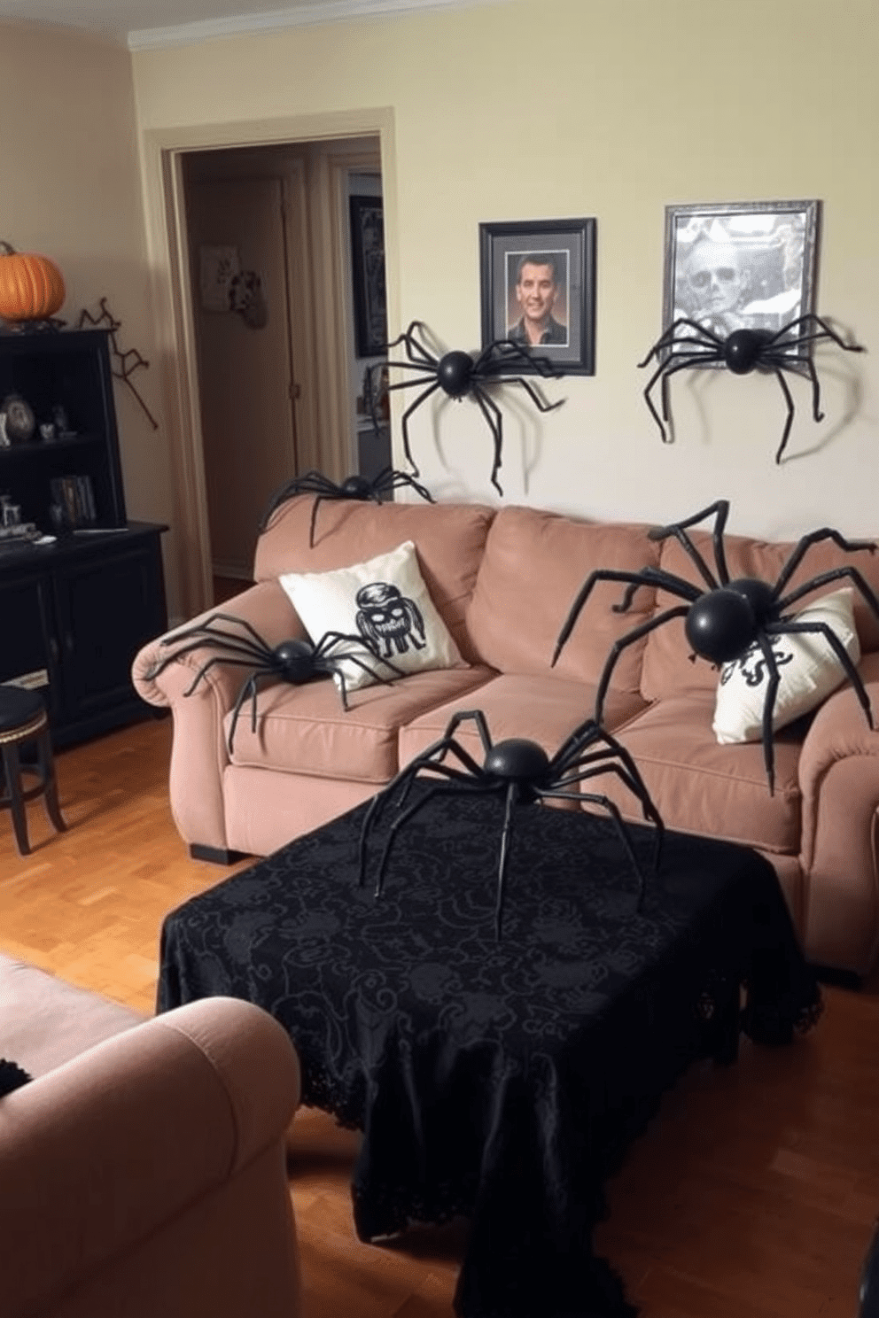 A whimsical Halloween apartment setting featuring giant spider props strategically placed on various pieces of furniture. The living room showcases a cozy sofa adorned with spider-themed cushions and a coffee table draped in a black lace tablecloth, enhancing the spooky atmosphere.