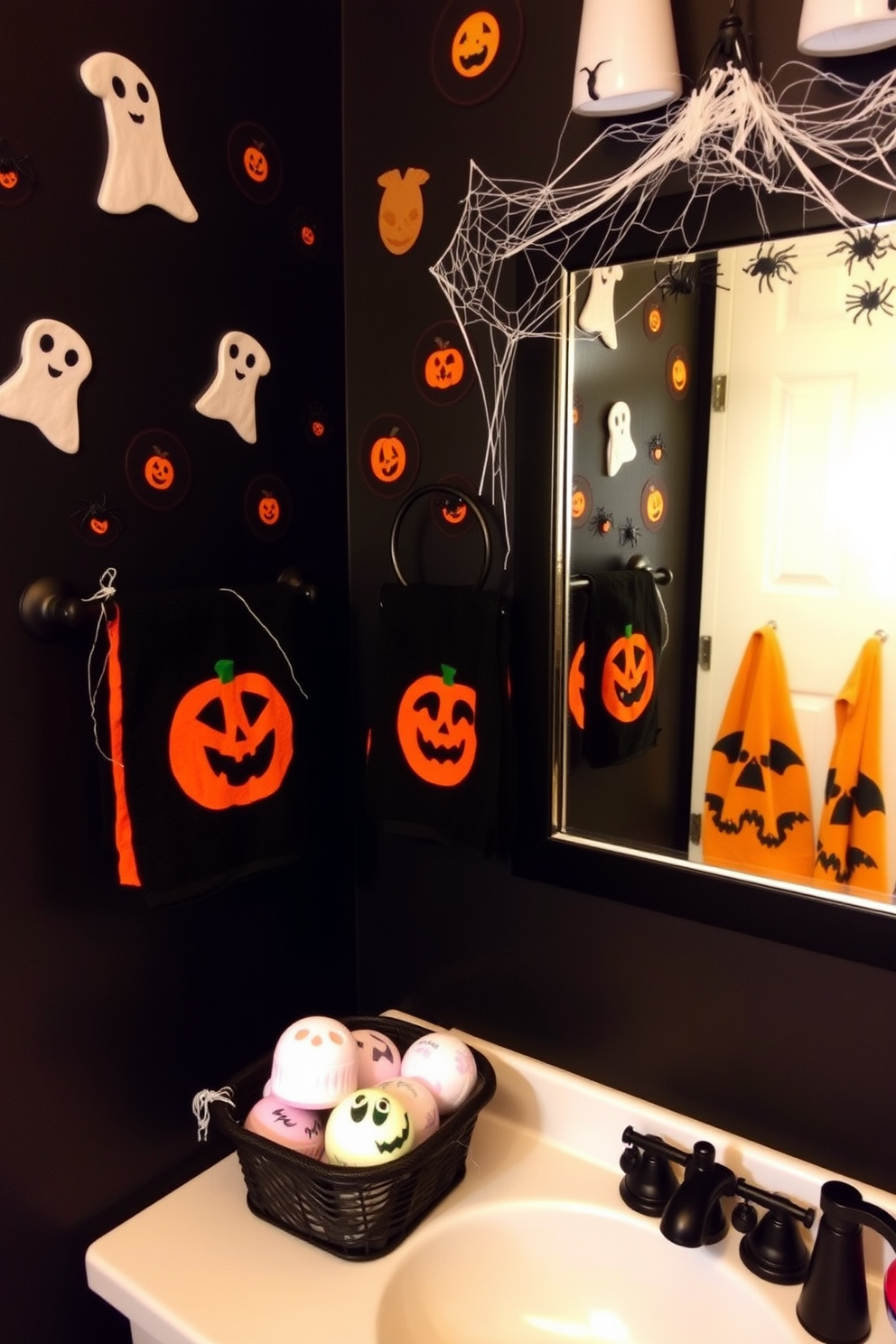 A whimsical bathroom setting featuring Halloween-themed bath bombs and soaps displayed in a decorative basket. The walls are adorned with playful Halloween decorations such as ghost and pumpkin motifs, creating a festive atmosphere. A black and orange color scheme dominates the space, complemented by spooky-themed towels hanging on a rack. A mirror is framed with cobwebs and mini plastic spiders, adding a fun touch to the overall decor.