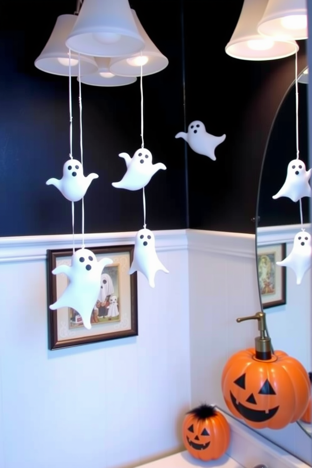 Create a whimsical Halloween bathroom setting featuring hanging ghost decorations from the light fixtures. The walls are adorned with spooky-themed artwork and the countertop displays a pumpkin-shaped soap dispenser.