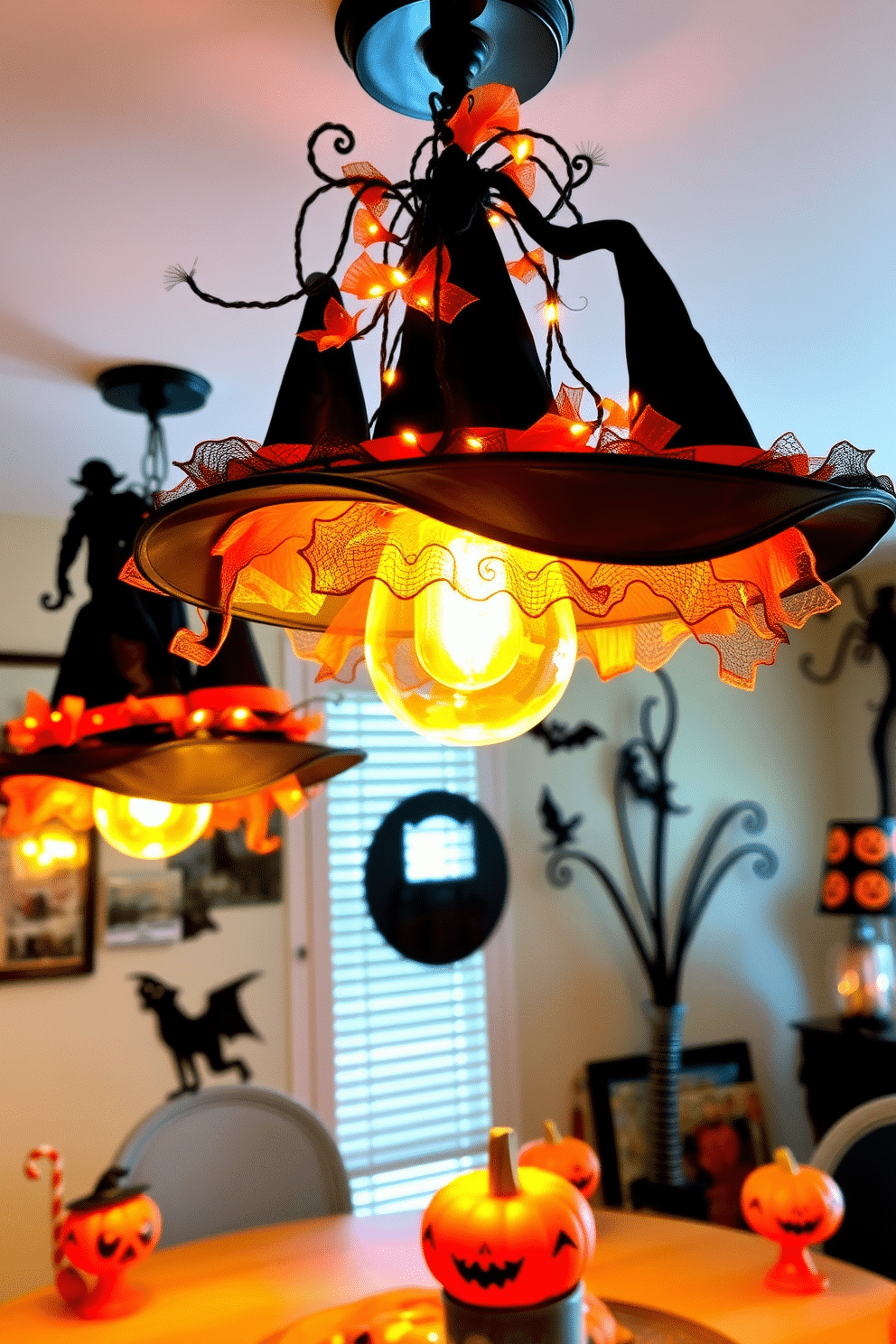 Witch hats are creatively draped over light fixtures, adding a whimsical touch to the room. The warm glow of the lights enhances the festive atmosphere, making the space feel inviting and playful. Black and orange accents are used throughout the decor, complementing the witch hat theme. Spooky silhouettes and playful elements are strategically placed to create a cohesive Halloween ambiance.