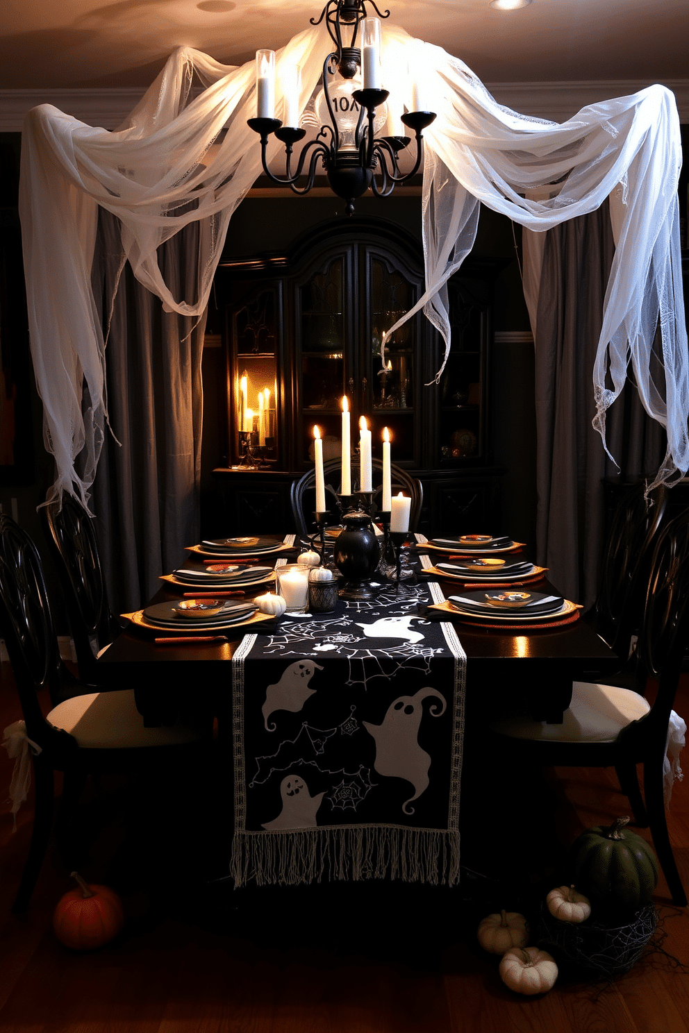 Creepy ghost decorations drape over elegant dining chairs, creating an eerie yet whimsical atmosphere for Halloween. The table is set with dark, moody tableware, and flickering candles cast shadows that dance across the room. In the center, a ghostly table runner features playful designs of spirits and cobwebs. Surrounding the table, dim lighting enhances the spooky ambiance, while small pumpkins and faux spider webs add to the festive decor.