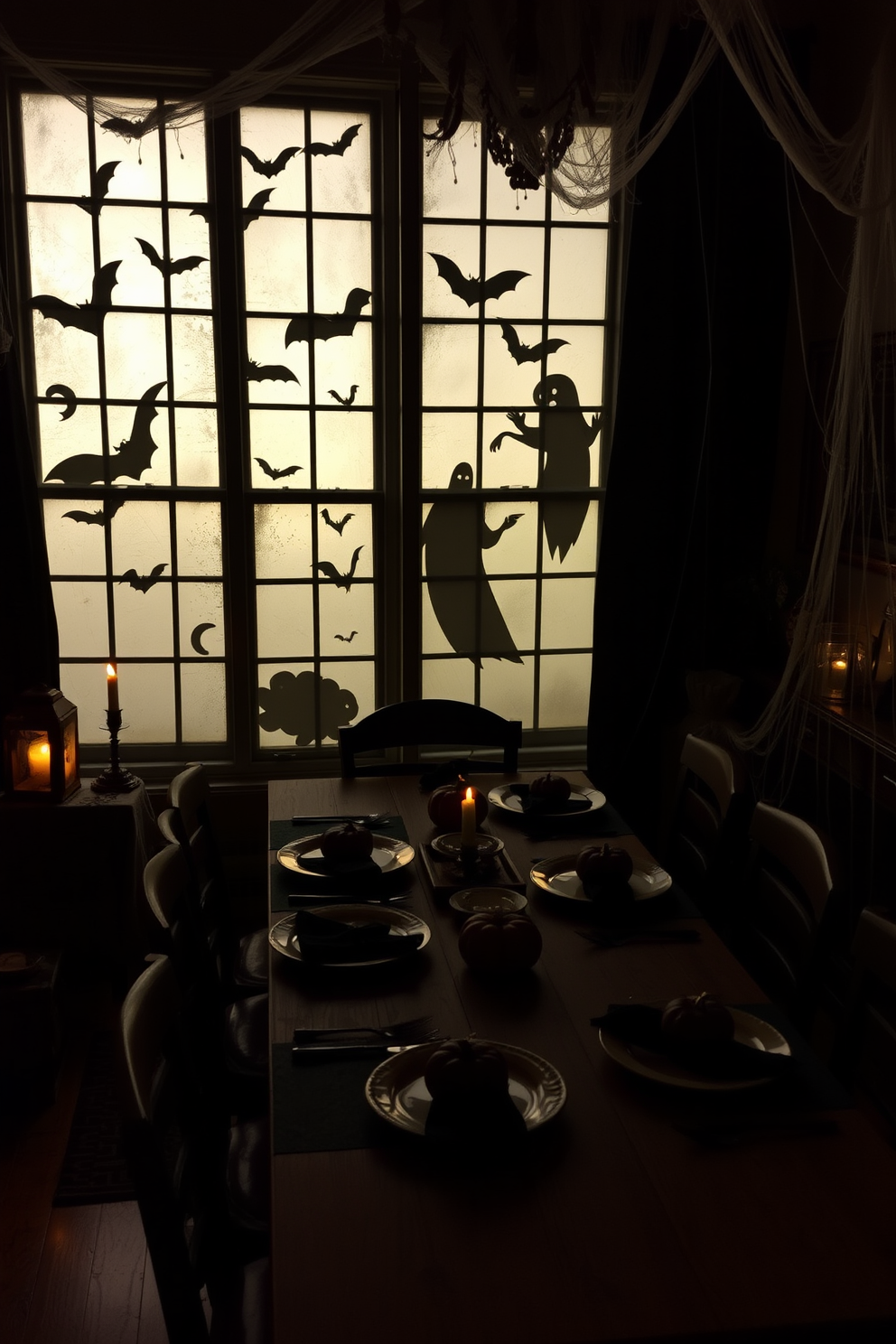 Spooky silhouettes of bats and ghosts are cast on the window panes, creating an eerie atmosphere for the Halloween celebration. The dining room is adorned with dark tablecloths and flickering candlelight, enhancing the haunting vibe. A long wooden dining table is set with vintage-style plates and black napkins, complemented by small pumpkin centerpieces. Cobwebs are draped across the corners, and dim lighting adds to the mysterious charm of the space.