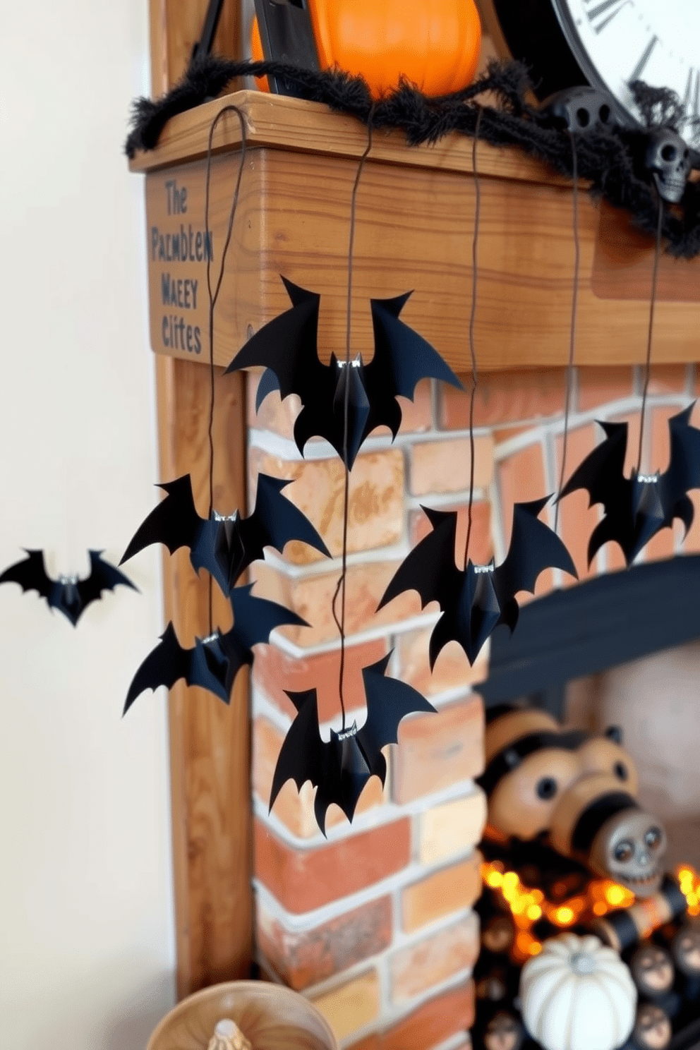 A cozy fireplace adorned for Halloween features a rustic wooden mantel. Hanging bats made of black paper dangle from the edge, creating a spooky atmosphere.