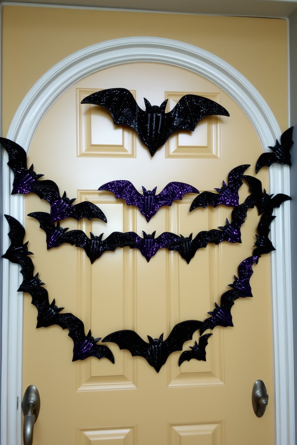 A whimsical Halloween front door is adorned with a glittery bat garland that stretches elegantly across the top. The bats are crafted in various sizes, shimmering in shades of black and purple, creating a festive and spooky atmosphere.