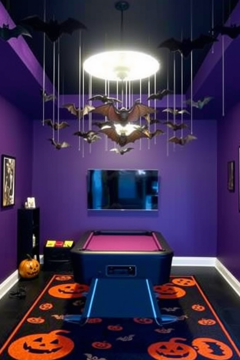 Create a spooky Halloween game room with hanging bats suspended from the ceiling to enhance the atmosphere. The walls are painted in deep purple, and the floor is covered with a black and orange rug featuring Halloween motifs.