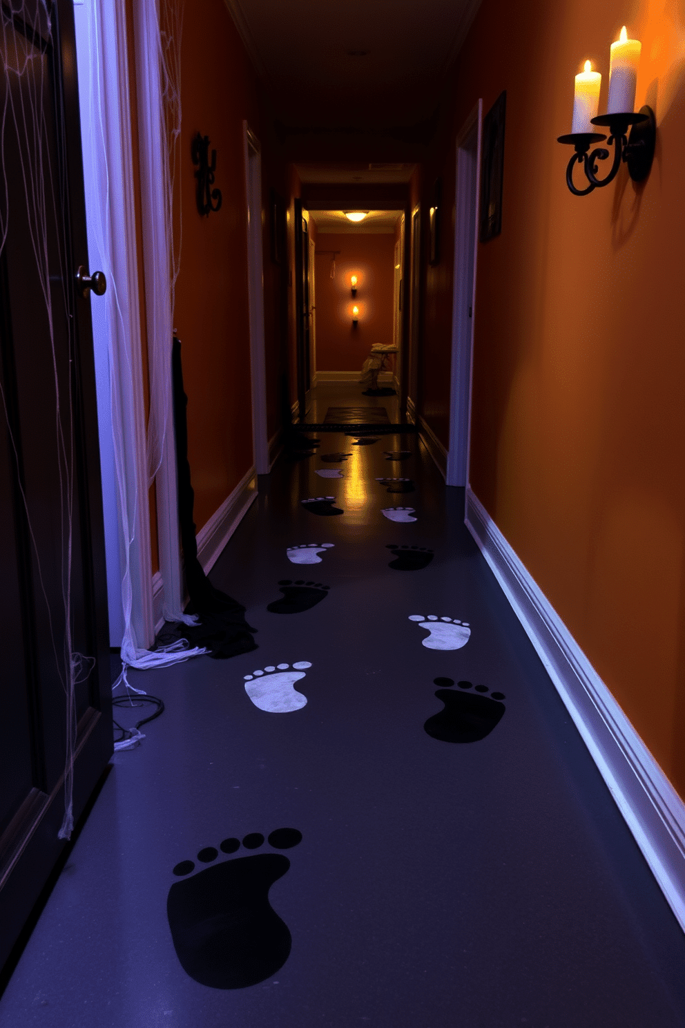 A Halloween hallway decorated with floor stickers resembling spooky footprints. The footprints lead guests through a dimly lit corridor adorned with cobwebs and flickering candle lights.