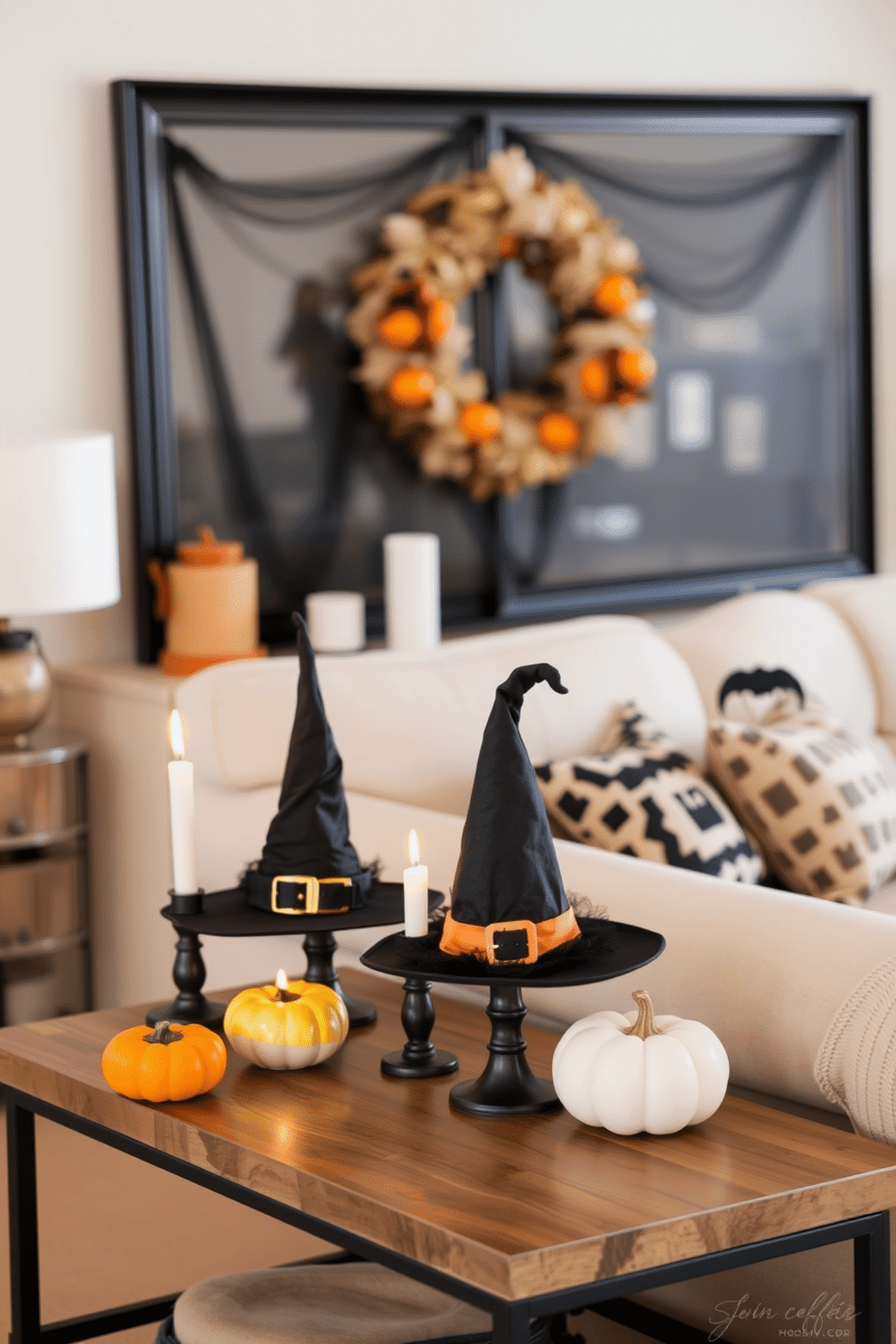 A cozy living room adorned with witch hat decor on side tables. The side tables are styled with black and orange accents, featuring whimsical witch hats alongside flickering candles and small pumpkins.