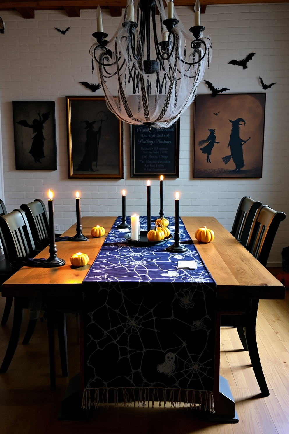 A spooky themed table runner stretches across a rustic wooden dining table, adorned with cobweb patterns and ghostly silhouettes. Flickering candlelight casts eerie shadows, while small pumpkins and black candles complete the haunting atmosphere. Above the table, a vintage chandelier draped with faux spider webs adds to the Halloween charm. Dark, moody wall art featuring bats and witches enhances the loft's festive decor, inviting guests into a whimsical yet spooky dining experience.