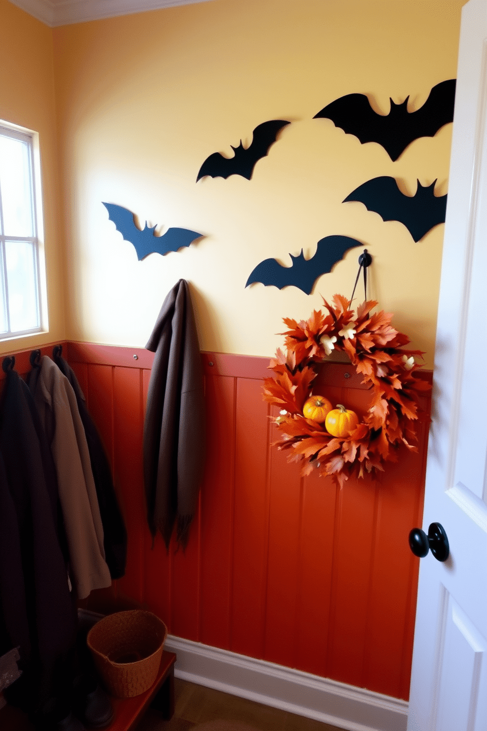 A cozy mudroom decorated for Halloween features a warm color palette with deep oranges and rich browns. Bat silhouettes are artfully arranged on the wall, creating a spooky yet inviting atmosphere. The space includes functional storage solutions such as hooks for coats and a bench for shoes. A festive wreath adorned with autumn leaves and miniature pumpkins hangs on the door, enhancing the seasonal charm.