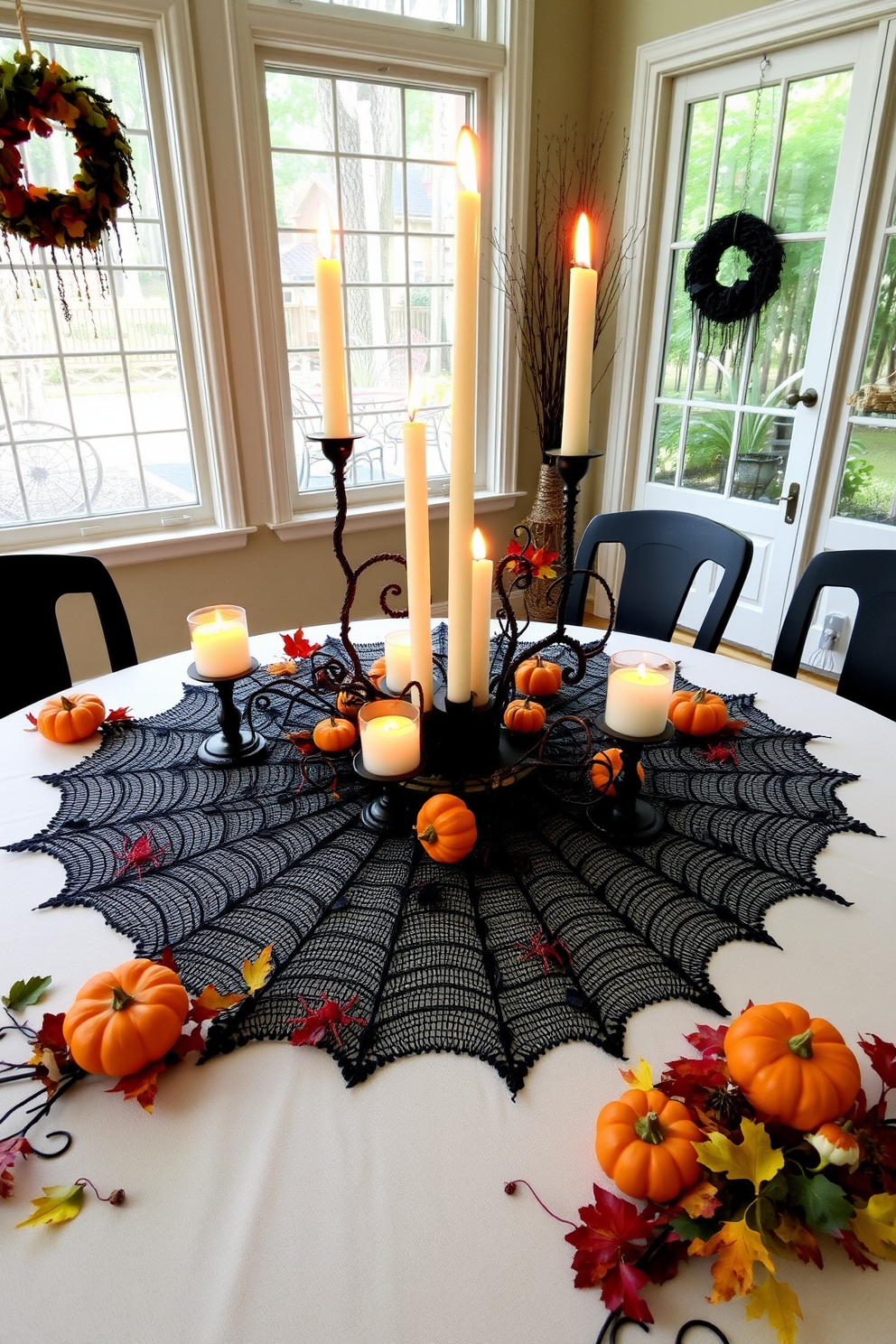 A spooky spider web table centerpiece fills the sunroom with an eerie charm. The table is adorned with delicate black lace resembling a spider web, featuring small plastic spiders nestled throughout the design. Surrounding the centerpiece are flickering candle holders shaped like pumpkins, casting an inviting glow. A mix of autumn leaves and miniature gourds in vibrant colors complements the Halloween theme, creating a festive atmosphere.