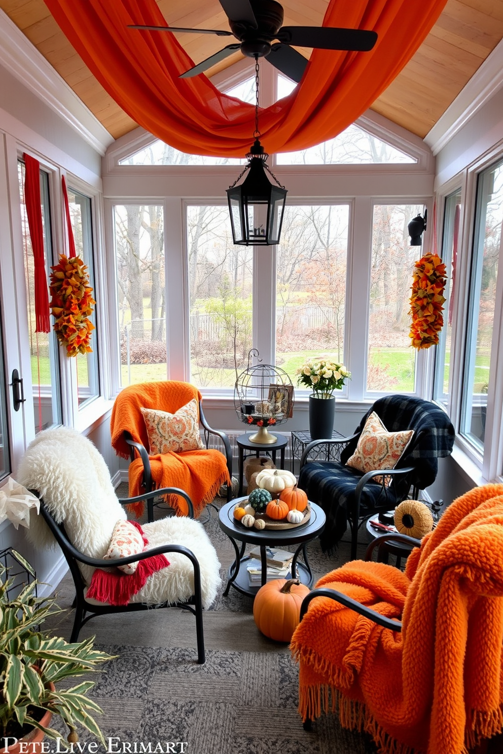 A cozy sunroom adorned with soft blankets in Halloween colors. The space features a comfortable seating area with plush chairs and a small coffee table surrounded by autumn-themed decorations.