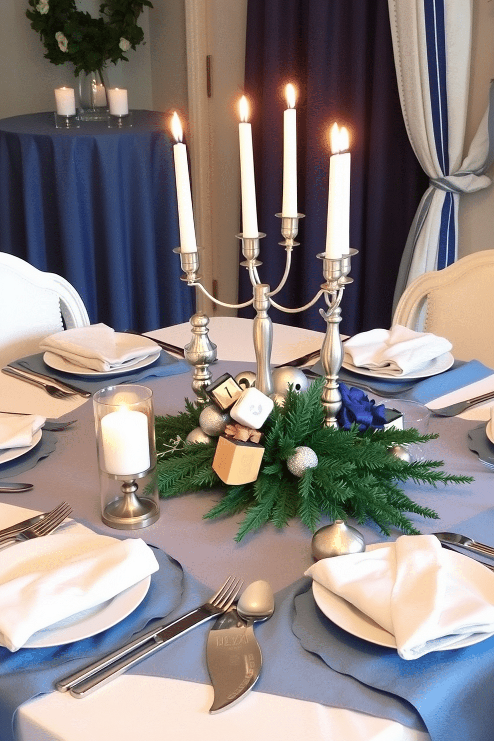 A beautifully set dining table adorned with layered tablecloths in shades of blue and white, creating a festive yet elegant atmosphere for Hanukkah celebrations. The table is complemented by silver candlesticks holding lit candles, and a centerpiece featuring a mix of traditional and modern decor elements, including dreidels and seasonal greenery.