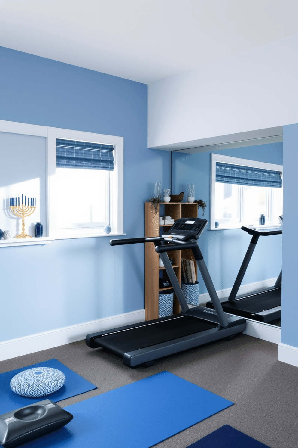 A serene home gym featuring blue and white wall paint that creates a calming atmosphere. The space includes a sleek treadmill and a set of weights, with a large mirror reflecting the natural light from a nearby window. The room is adorned with subtle Hanukkah decorations, such as a decorative menorah on a shelf and blue and silver accents throughout. A cozy area with yoga mats and cushions invites relaxation and mindfulness practices.