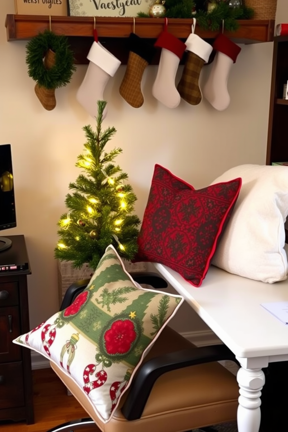 A cozy home office setting adorned for the Christmas season. The office chair is decorated with seasonal throw pillows featuring festive patterns in red, green, and gold. A small evergreen tree sits on the corner of the desk, twinkling with warm white lights. Stockings hang from a shelf above the desk, adding a touch of holiday cheer to the workspace.