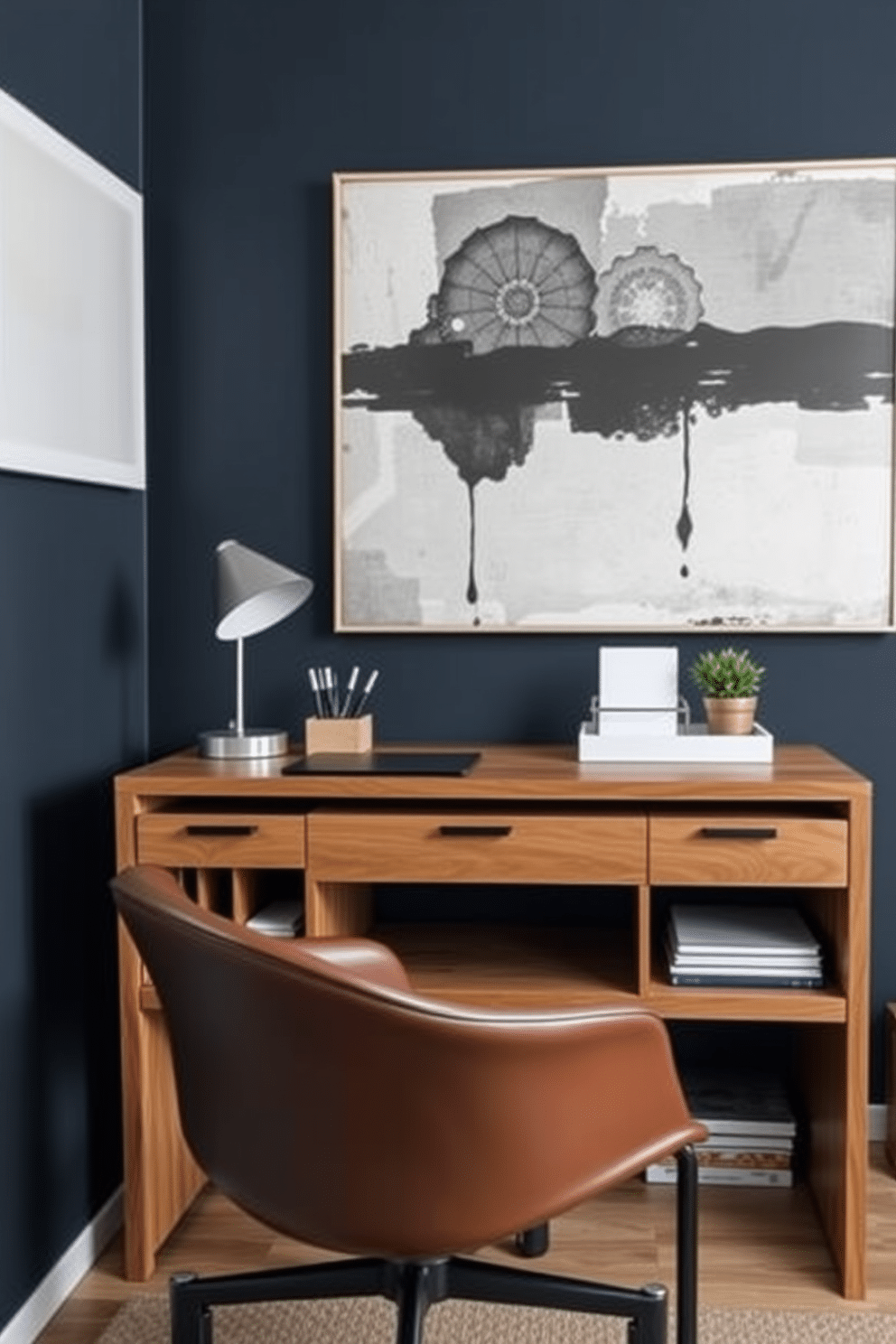 A sleek home office space designed for men, featuring a modern wooden desk with integrated storage solutions. The desk is organized with stylish desk organizers, including a minimalist pen holder and a document tray, ensuring a tidy workspace. The walls are painted in a deep navy blue, complemented by a large abstract painting above the desk. A comfortable leather chair sits in front of the desk, and a small potted plant adds a touch of greenery to the overall design.