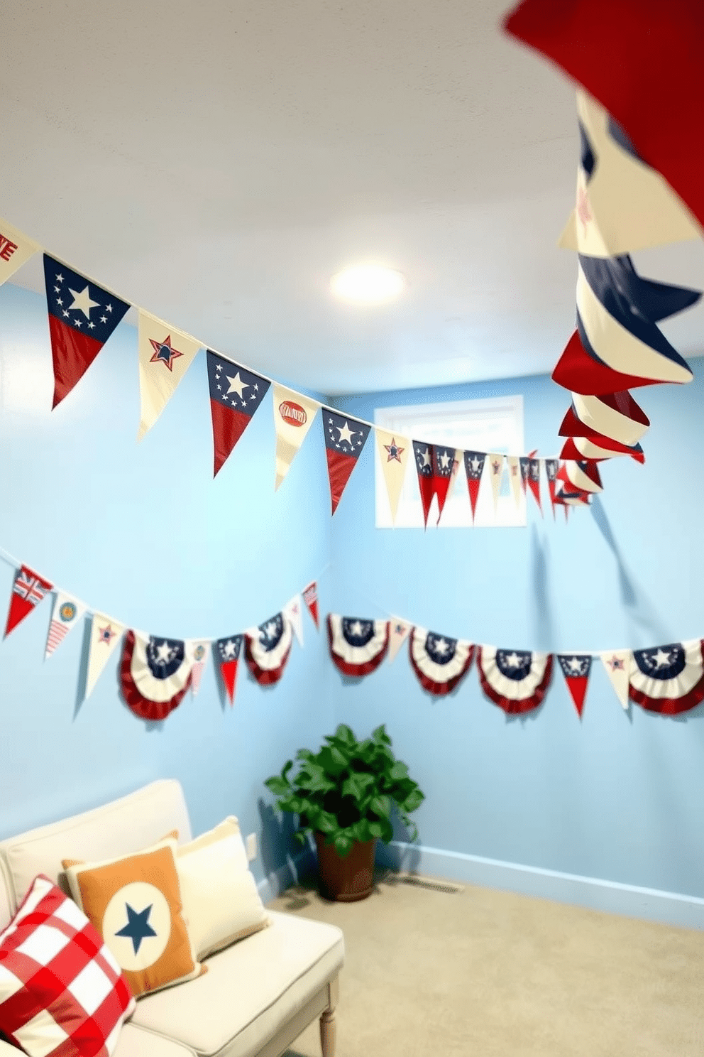 A cozy basement space decorated for Independence Day features vintage flag bunting strung across the ceiling. The walls are painted in a soft blue, and a comfortable seating area with red and white cushions invites relaxation.