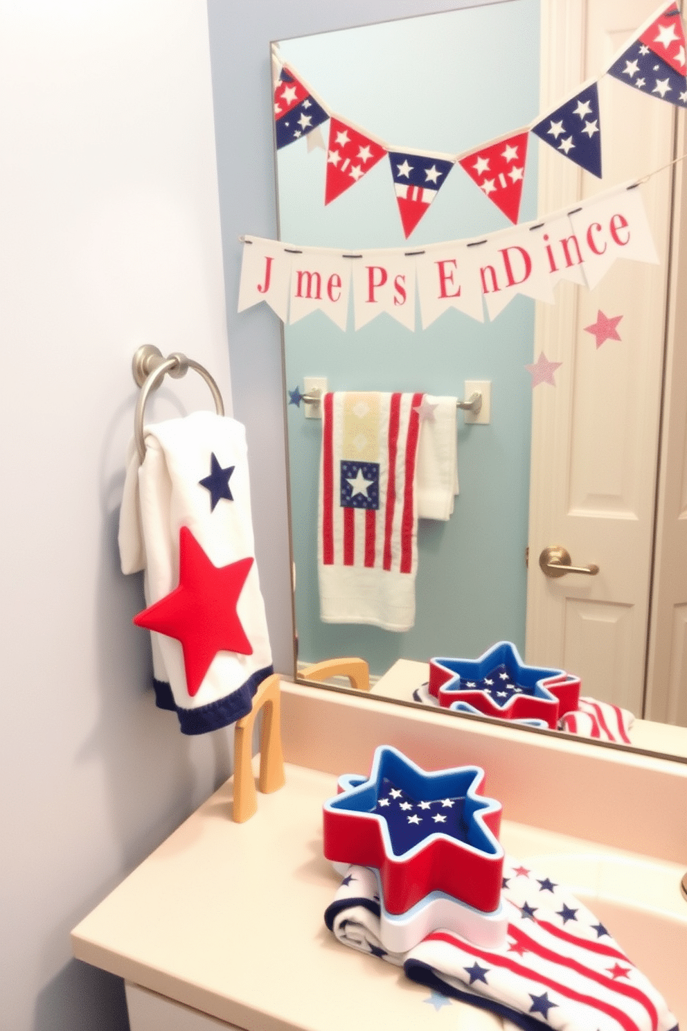 A festive bathroom setting celebrating Independence Day. Star shaped soap dishes in red, white, and blue colors are placed on the countertop beside a patriotic themed towel. The walls are adorned with subtle star patterns in a light blue hue. A decorative banner featuring stars and stripes hangs above the mirror, enhancing the holiday spirit.