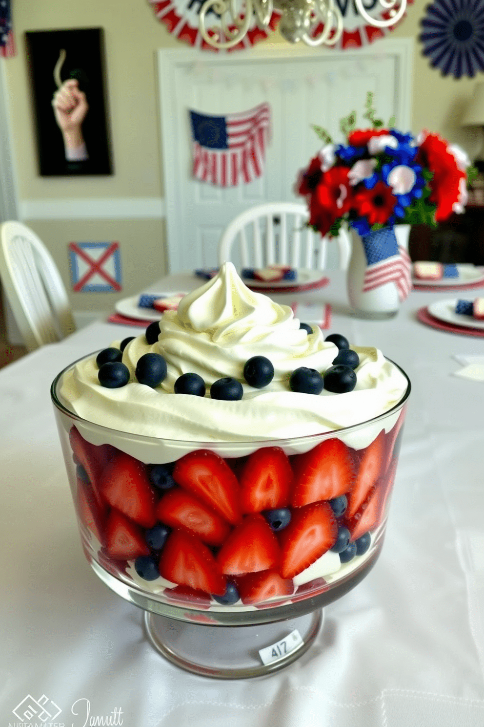 A vibrant dessert display featuring layers of fresh strawberries and blueberries topped with a generous swirl of whipped cream. The dessert is elegantly arranged in a glass dish, showcasing the rich colors and textures, set against a soft white tablecloth. A festive dining room decorated for Independence Day with a patriotic color scheme of red, white, and blue. The table is adorned with star-spangled tableware, and a centerpiece of fresh flowers in these colors adds a cheerful touch to the celebration.