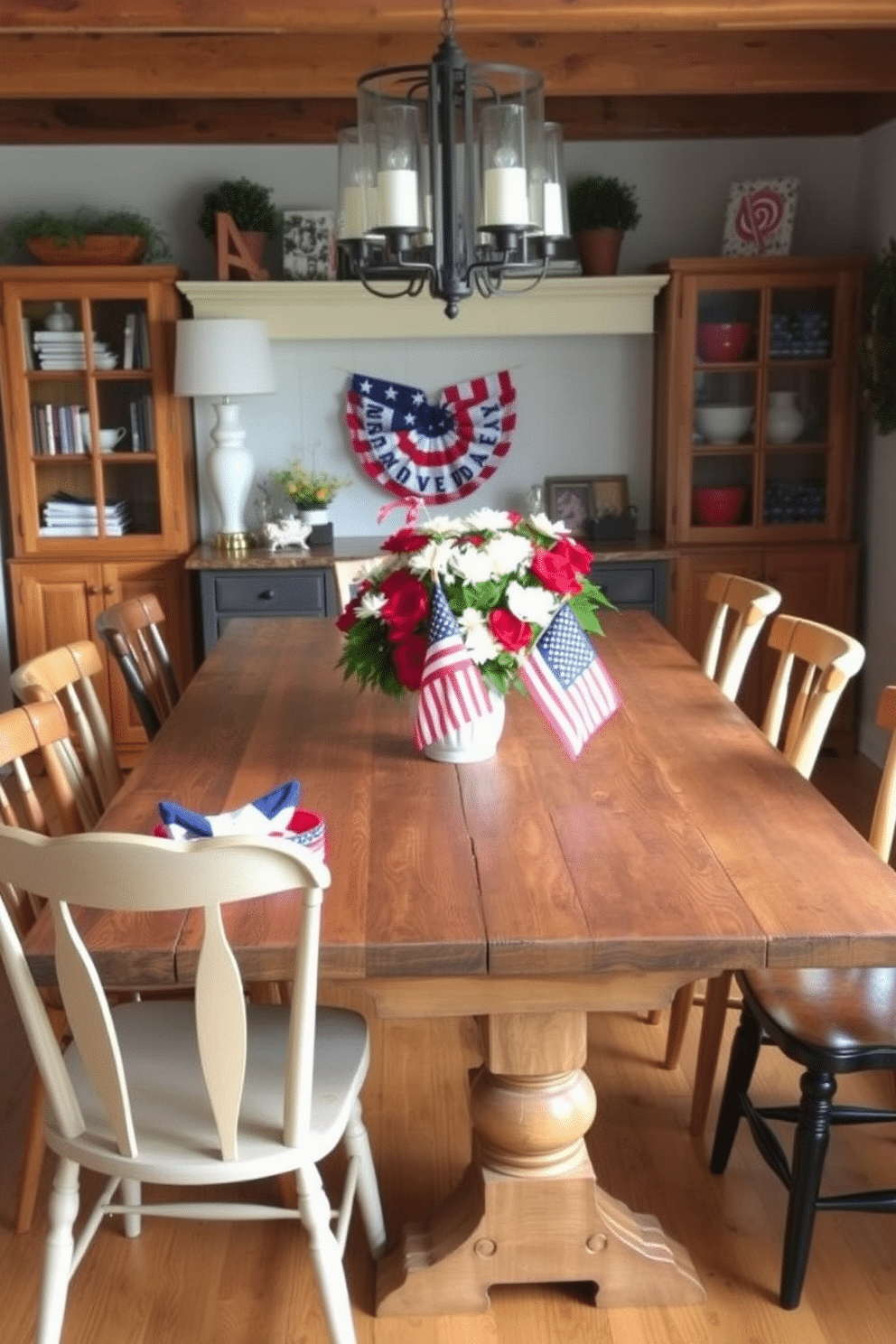 A rustic wood table is the centerpiece of a farmhouse dining room. Surrounding the table are mismatched chairs in warm tones, creating an inviting atmosphere. For Independence Day, the dining room is adorned with red, white, and blue decorations. A centerpiece of fresh flowers in patriotic colors sits on the table, complemented by themed tableware.