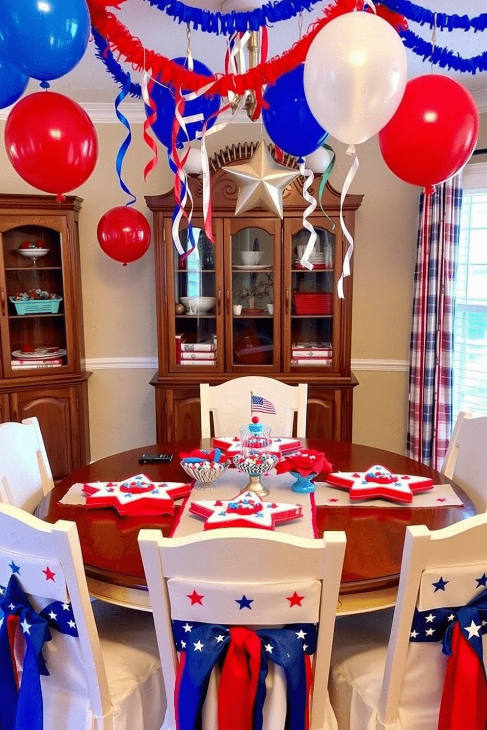 A festive dining room setting for Independence Day. The table is adorned with star shaped cookie platters filled with red white and blue treats. The chairs are draped with patriotic table runners featuring stars and stripes. Balloons and streamers in vibrant colors hang from the ceiling creating a celebratory atmosphere.