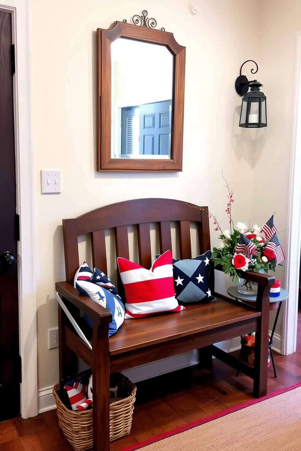 A charming entryway features a wooden bench adorned with vibrant patriotic cushions in red white and blue. Above the bench hangs a decorative mirror framed in rustic wood reflecting the warm light from a nearby lantern. The walls are painted a soft cream color creating a welcoming atmosphere. A small table next to the bench holds a vase of fresh flowers and a collection of festive decorations celebrating Independence Day.