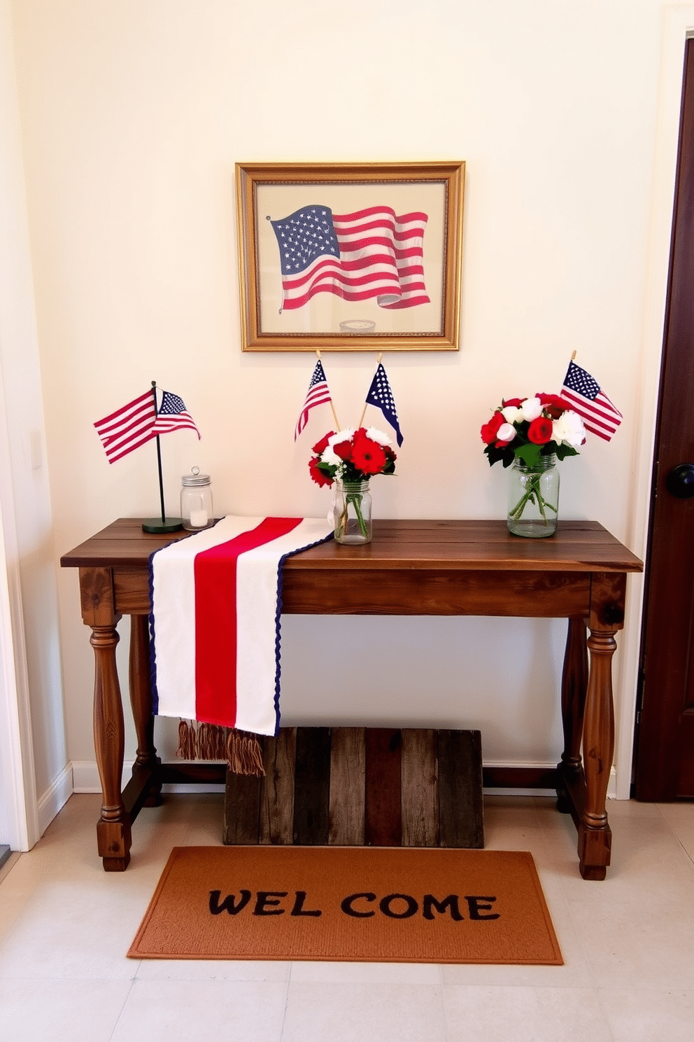 A warm and inviting entryway featuring a vibrant Americana inspired table runner draped elegantly across a rustic wooden console table. The table is adorned with small decorative flags, a vintage lantern, and a bouquet of red, white, and blue flowers in a mason jar. The walls are painted in a soft cream color, providing a neutral backdrop that enhances the patriotic decor. A welcoming doormat with stars and stripes welcomes guests, while a framed piece of Americana art hangs above the table, completing the festive look.