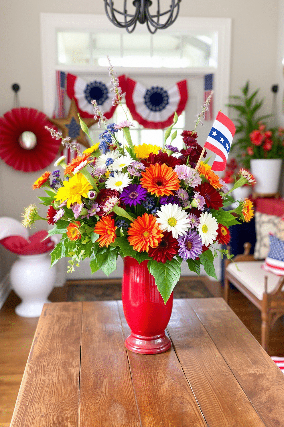 A vibrant floral arrangement featuring an array of colorful flowers in a striking red vase sits prominently on a rustic wooden table. The entryway is adorned with festive decorations celebrating Independence Day, including red, white, and blue accents that create a warm and inviting atmosphere.