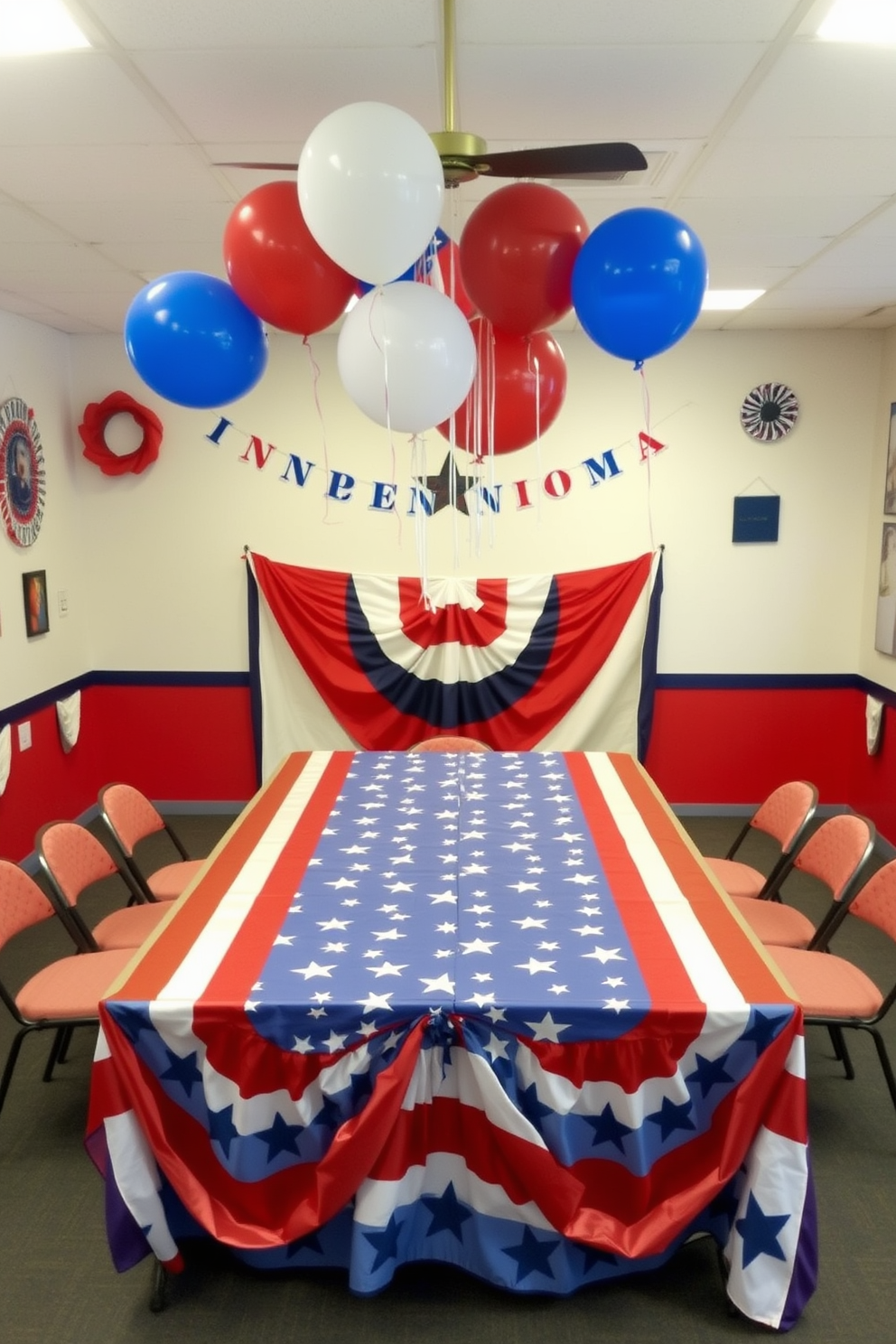 A vibrant game room decorated for Independence Day features a large table covered with a star and stripe themed tablecloth. The walls are adorned with red, white, and blue decorations, and festive balloons float above the table, creating a celebratory atmosphere.