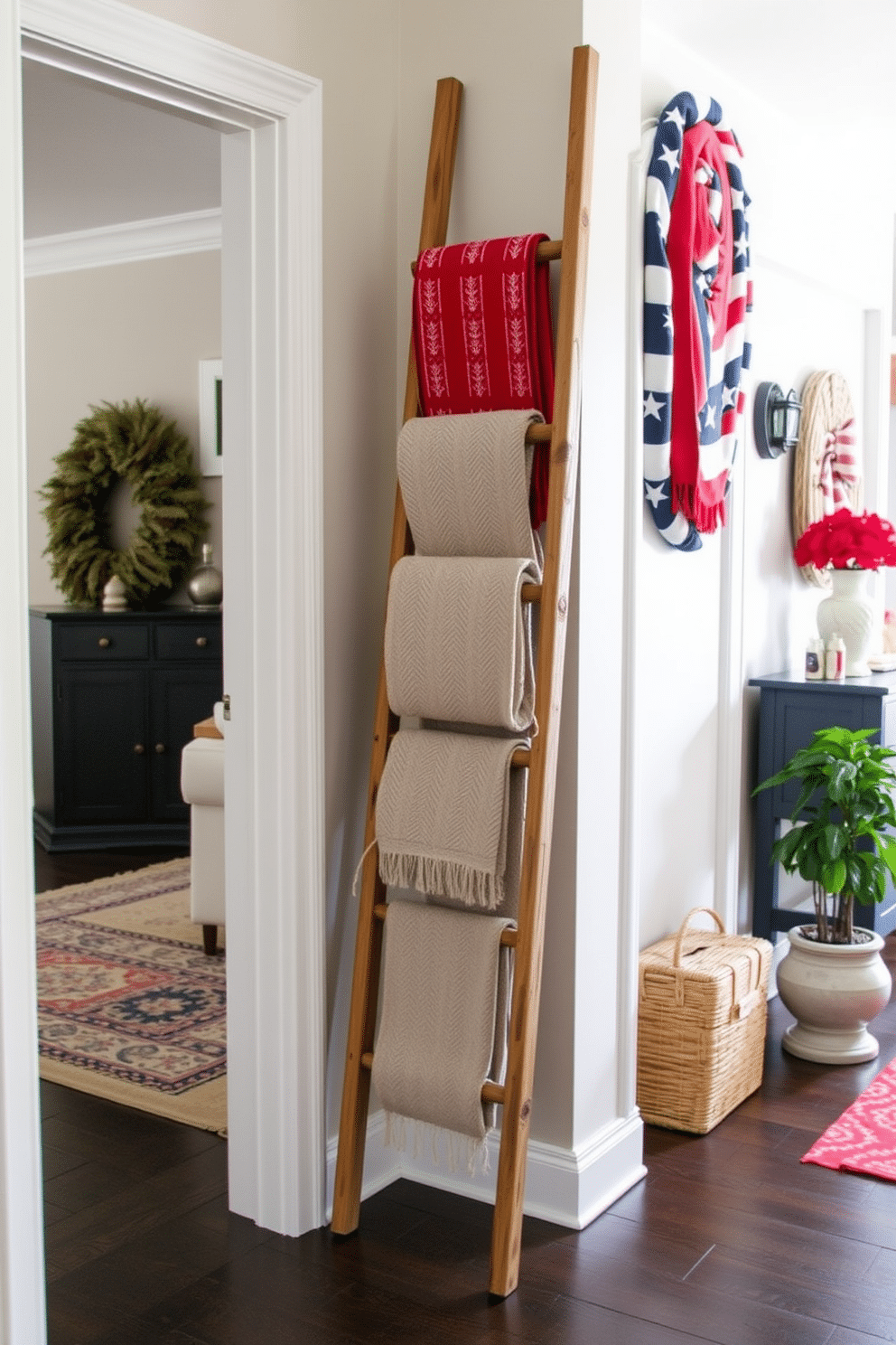 A decorative ladder is leaning against the wall in the hallway, showcasing a collection of red white and blue throws. The space is adorned with subtle Independence Day accents, creating a festive yet elegant atmosphere.