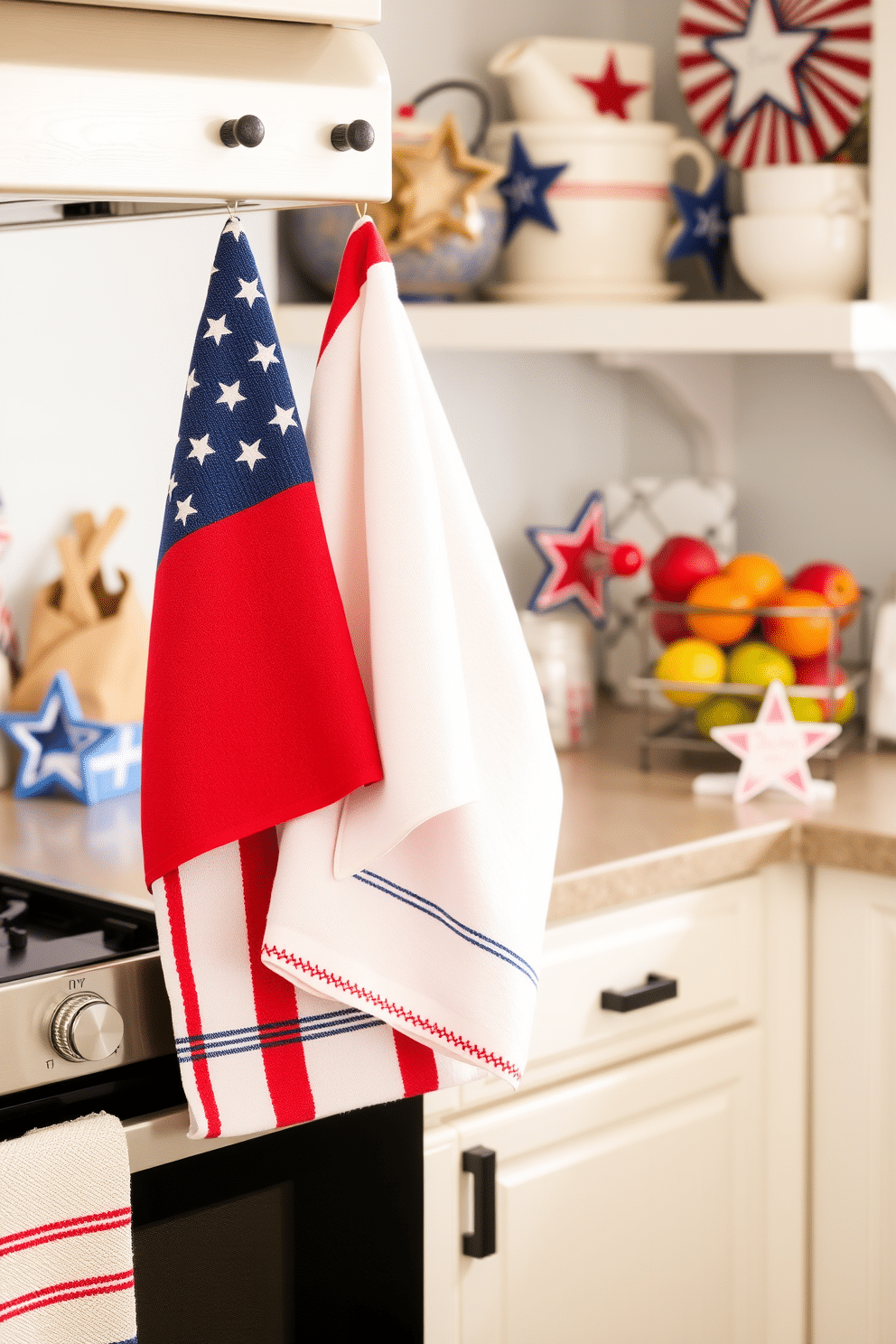 A charming kitchen scene adorned with red white and blue kitchen towels hanging from the oven handle. The countertops are decorated with festive Independence Day accents including star-shaped cookie cutters and a bowl of fresh fruit.