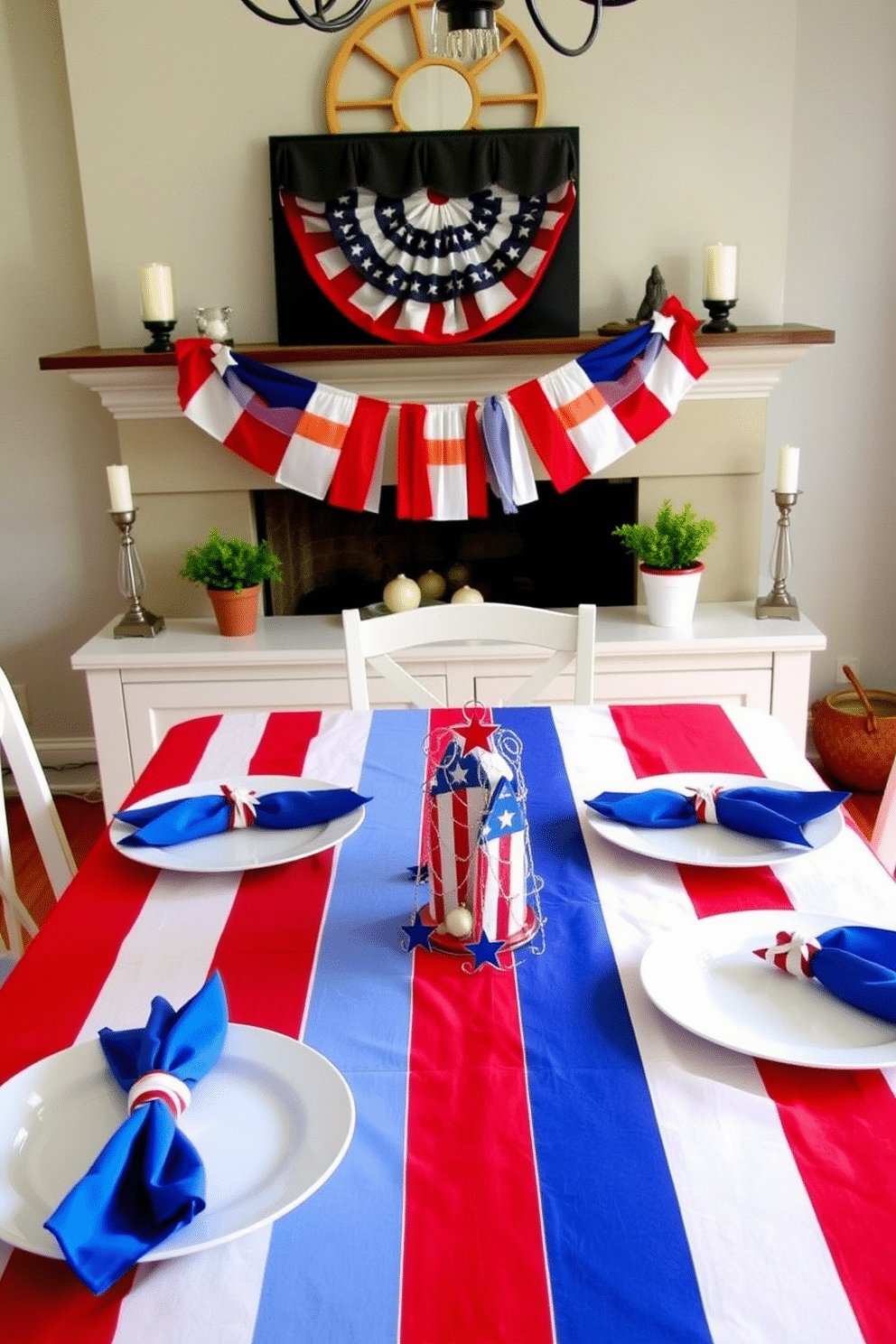 A festive dining table is set with a red blue and white striped tablecloth that adds a vibrant touch to the celebration. On the table, there are white plates adorned with blue napkins and small decorative items in the shape of stars. The mantel is decorated with a mix of patriotic elements including a garland of red white and blue bunting. Flanking the mantel are candles in glass holders and small potted plants that bring a fresh look to the Independence Day theme.