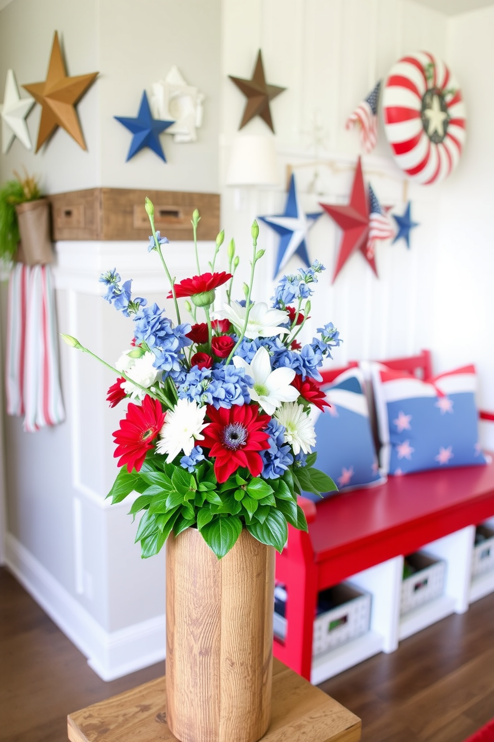 A vibrant arrangement of red white and blue flowers sits in a rustic wooden vase. The flowers are artfully arranged with lush greenery, creating a festive centerpiece perfect for celebrating Independence Day. The mudroom is decorated with patriotic accents, featuring a red bench with white cushions and blue throw pillows. A collection of stars and stripes decor adorns the walls, enhancing the festive atmosphere while providing functional storage solutions.