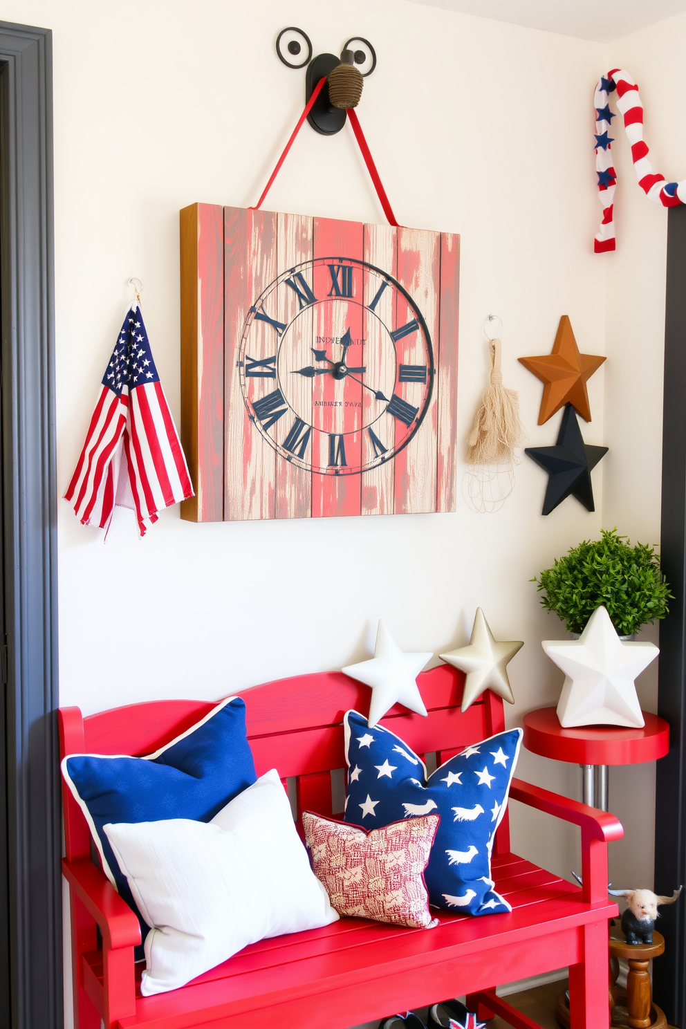 A charming Independence Day themed wall clock features a rustic wooden frame with red, white, and blue accents. The clock face displays stars and stripes, perfectly capturing the spirit of the holiday. The mudroom is decorated with Independence Day flair, showcasing a vibrant red bench adorned with blue and white throw pillows. Patriotic garlands and a collection of star-shaped decor pieces enhance the festive atmosphere.