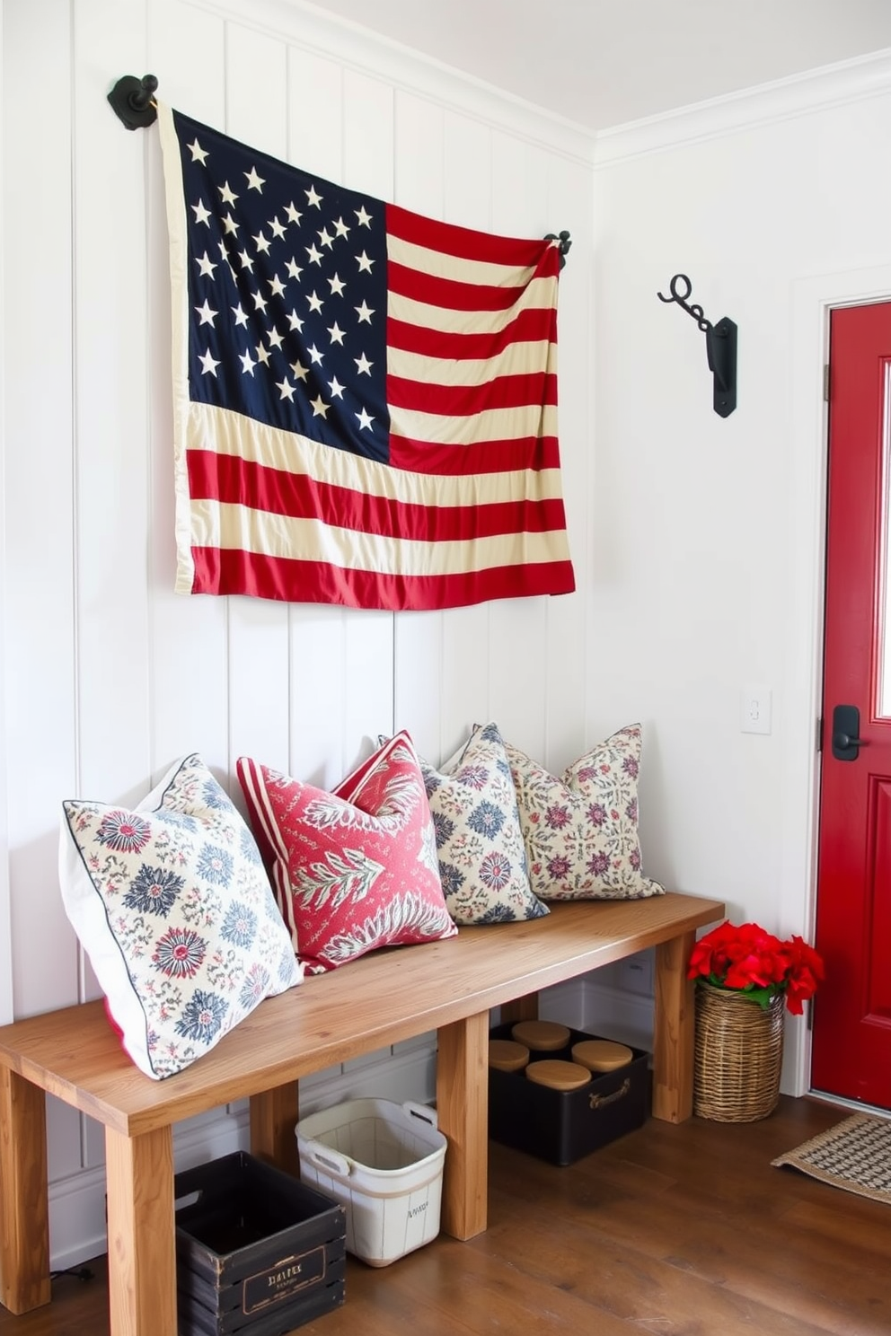 A cozy mudroom adorned with red white and blue patterned throw pillows on a rustic bench. The walls are painted in a crisp white, and a vintage American flag hangs prominently, creating a festive atmosphere for Independence Day.