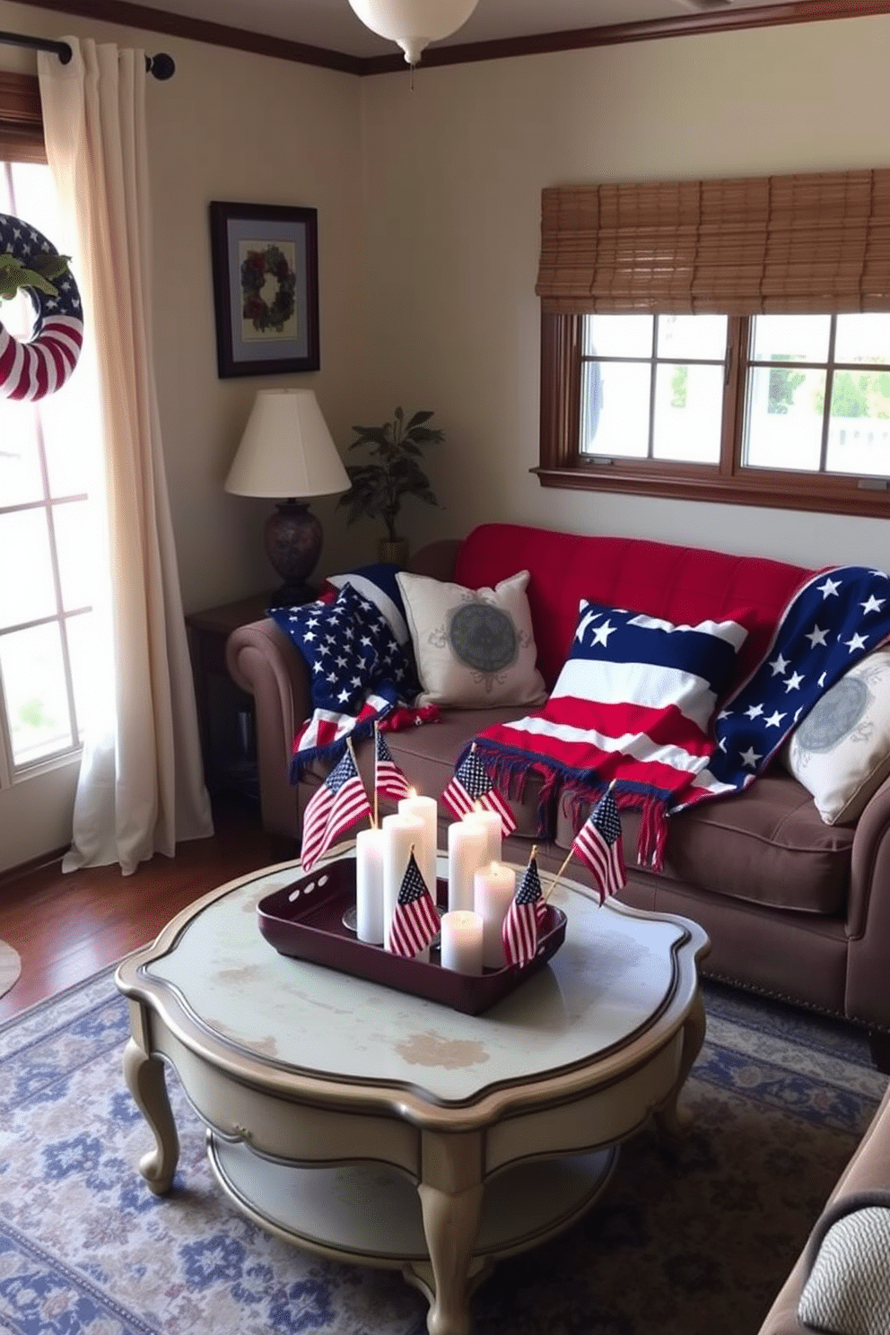 A cozy small living room adorned with patriotic blankets featuring red white and blue patterns draped over a plush sofa. The room is accented with decorative pillows and a vintage coffee table that holds a festive centerpiece of candles and small flags.