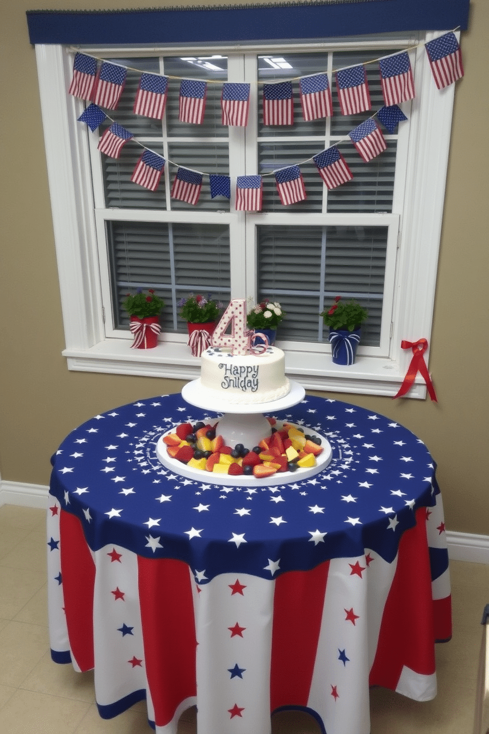 A festive Independence Day table display featuring a vibrant red, white, and blue tablecloth adorned with stars and stripes. Centered on the table is a large white platter filled with fresh fruit and a decorative cake celebrating the holiday. For window decorating ideas, hang strings of mini American flags and red, white, and blue bunting across the window. Add a few potted plants with patriotic ribbons tied around the pots to enhance the festive spirit.