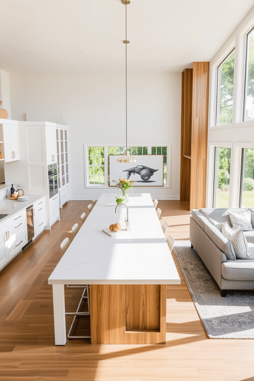 A spacious kitchen featuring a large central island with seating for four, topped with a sleek quartz countertop. Surrounding the island are modern bar stools, and the cabinetry is a blend of white and natural wood finishes, creating a warm and inviting atmosphere. The family room seamlessly integrates with the kitchen, featuring a cozy sectional sofa in soft gray fabric. A large area rug anchors the space, and floor-to-ceiling windows flood the room with natural light, complemented by tasteful artwork on the walls.