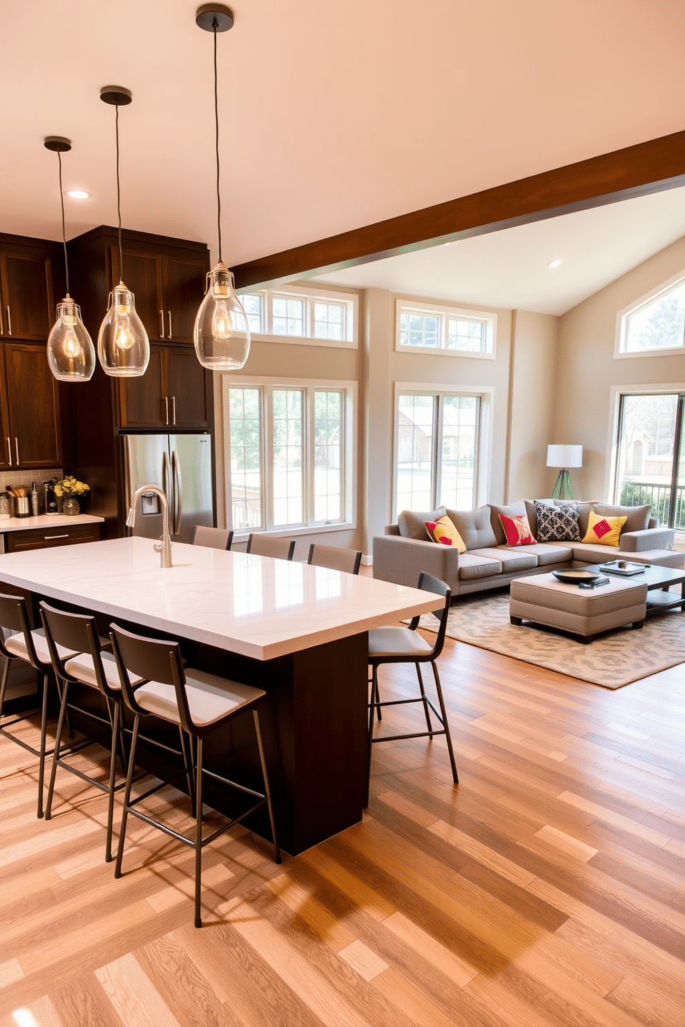 A spacious kitchen family room combo featuring a large island with a sleek quartz countertop, surrounded by stylish bar stools. Pendant lights hang above the island, providing warm illumination that enhances the open-concept layout. The family room is adorned with a comfortable sectional sofa in a neutral fabric, complemented by colorful throw pillows. A modern coffee table sits at the center, while large windows allow natural light to flood the space, creating a welcoming atmosphere.