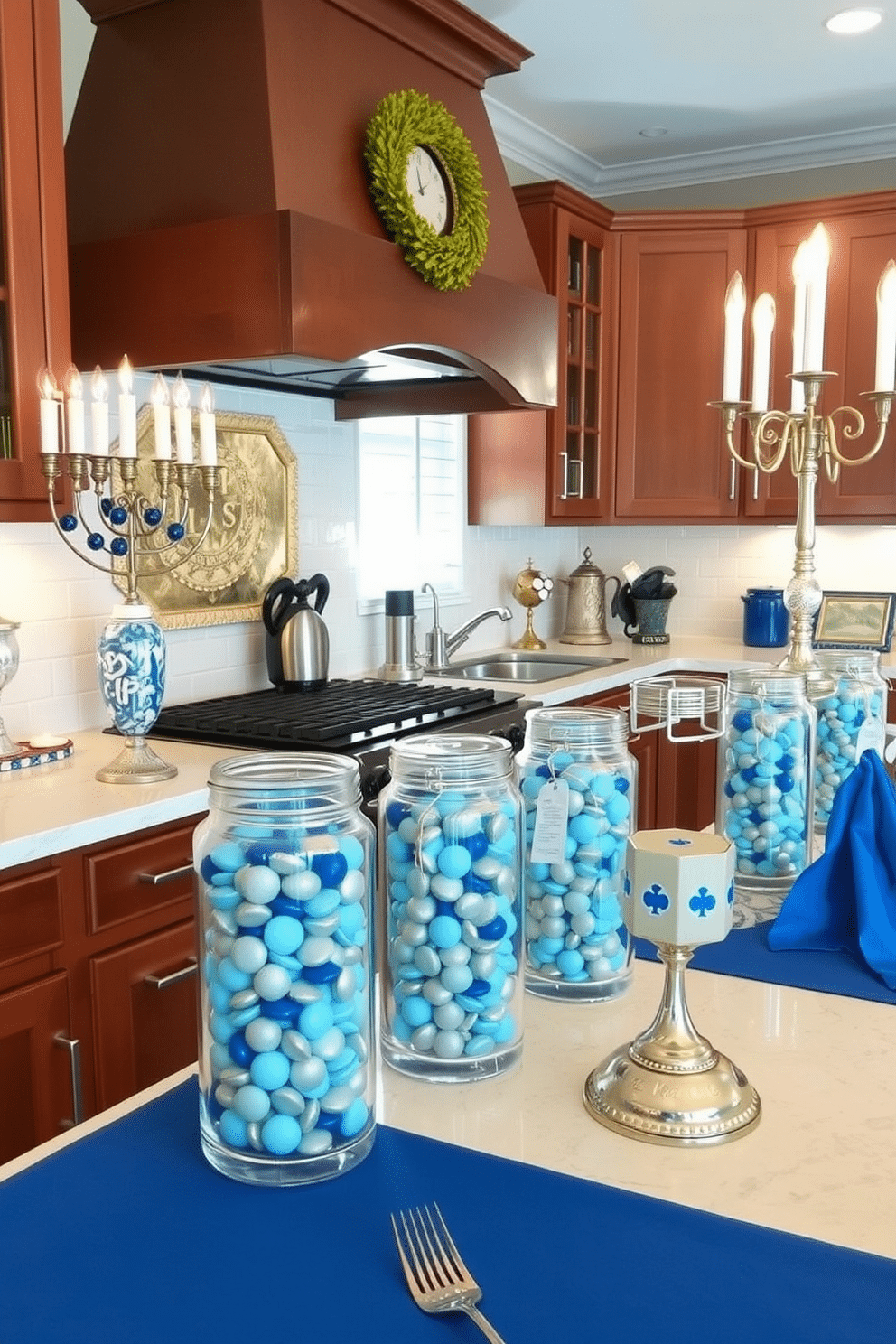 A festive kitchen adorned for Hanukkah features glass jars filled with blue and silver candies, creating a vibrant and inviting atmosphere. The countertops are decorated with elegant menorahs and traditional dreidels, while blue and white table linens add a touch of seasonal charm.