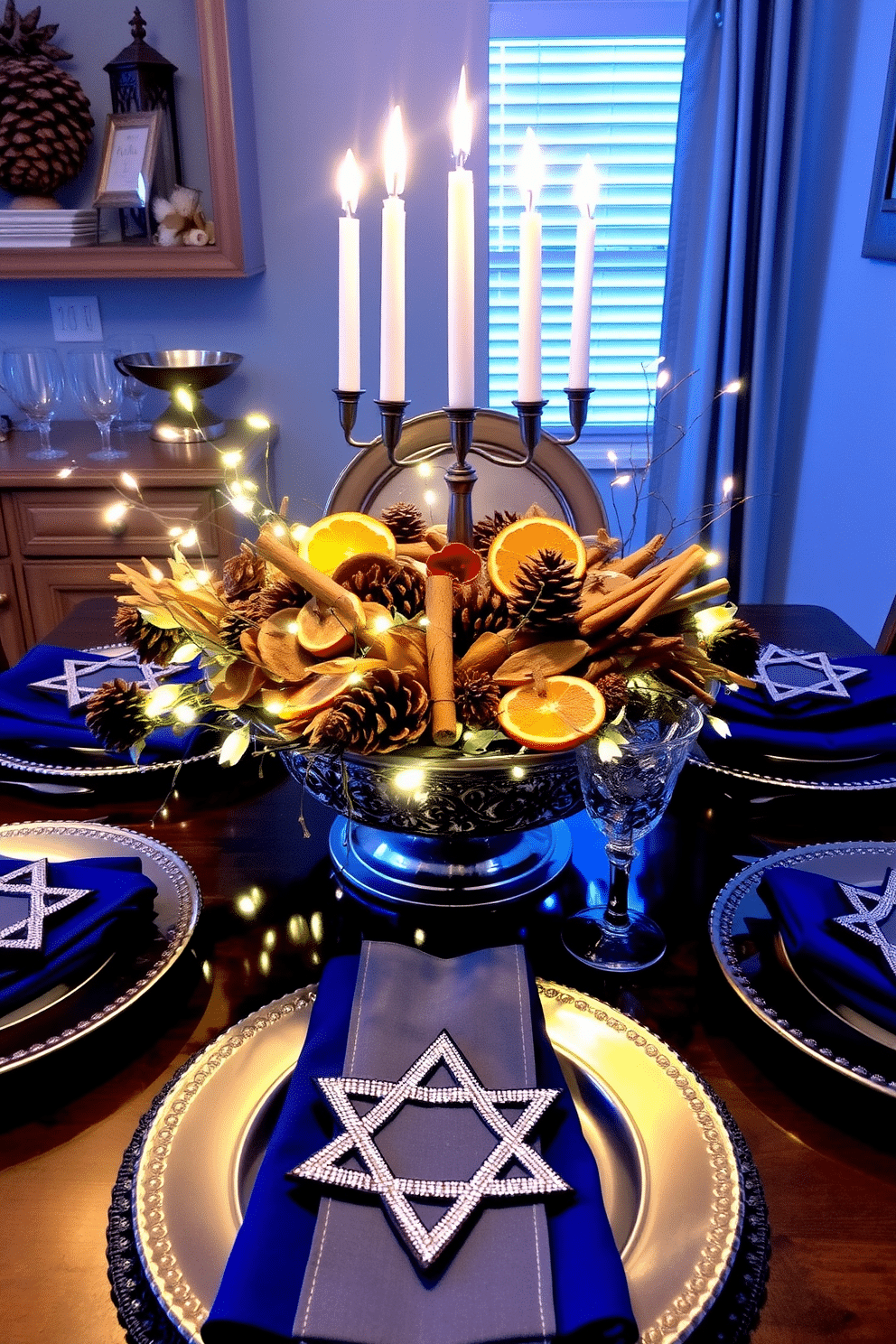 Seasonal potpourri with winter scents fills the air with a warm, inviting aroma. The arrangement features dried orange slices, cinnamon sticks, and pinecones nestled in a decorative bowl, surrounded by twinkling fairy lights. For the kitchen, Hanukkah decorating ideas include a vibrant blue and silver color scheme. A beautifully set table showcases a menorah at the center, flanked by elegant plates and festive napkins adorned with Star of David motifs.