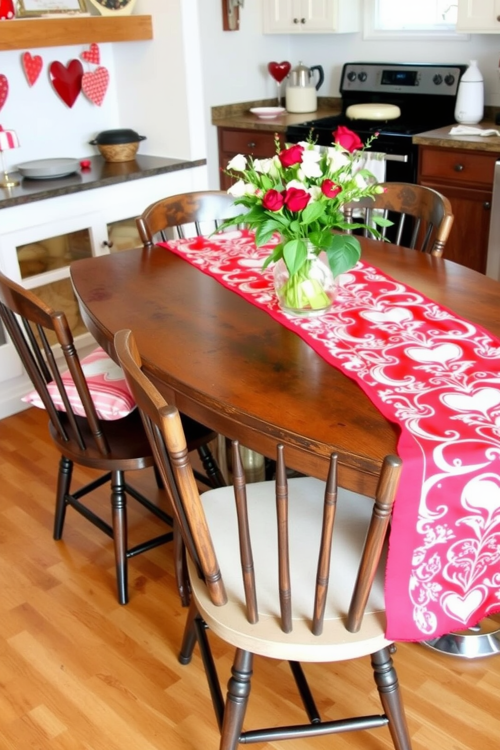 A festive kitchen setting adorned with a vibrant red and white table runner that elegantly drapes over a rustic wooden dining table. Surrounding the table are mismatched chairs, each adorned with small heart-shaped cushions, creating a warm and inviting atmosphere for Valentine's Day celebrations.