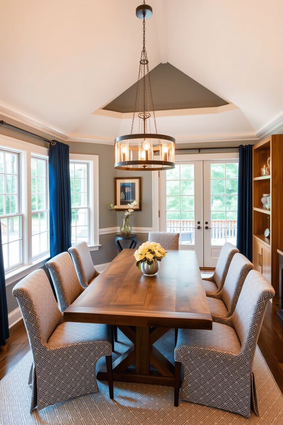 A cohesive color scheme unifies the L-shaped dining room, featuring soft neutrals complemented by pops of deep navy and warm wood tones. The dining table, crafted from reclaimed wood, is surrounded by upholstered chairs in a subtle geometric fabric, enhancing the overall aesthetic. Natural light floods the space through large windows, accentuating the carefully chosen color palette. A statement chandelier hangs above the table, providing both illumination and a focal point that ties the design together.