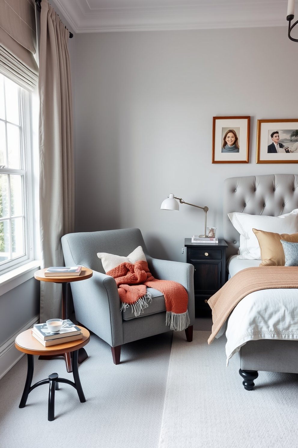 A cozy reading nook area features a plush armchair upholstered in soft gray fabric, positioned next to a large window that allows natural light to flood the space. A small wooden side table holds a stack of books and a steaming cup of tea, while a warm throw blanket is draped over the armchair for added comfort. The bedroom is decorated with a calming color palette of soft blues and whites, creating a serene atmosphere perfect for relaxation. A stylish bed with a tufted headboard is adorned with layered bedding and decorative pillows, while framed artwork hangs above the nightstands, adding a personal touch to the space.