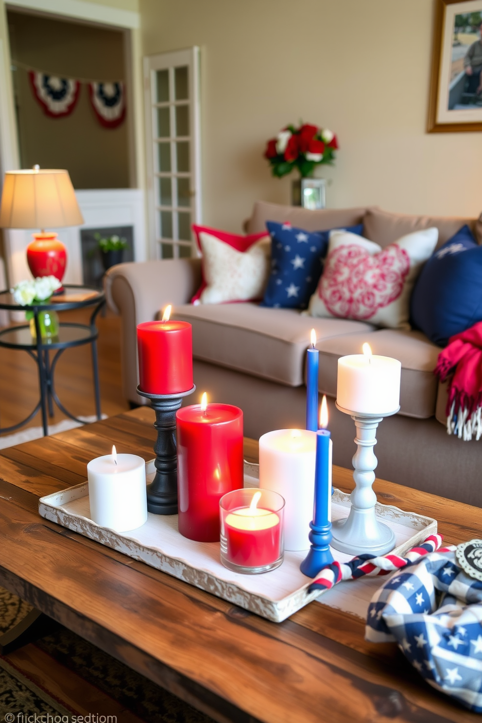 Create a cozy living room setting featuring red white and blue candles arranged on a rustic wooden coffee table. The soft glow of the candles enhances the festive atmosphere, complemented by patriotic decorations such as bunting and throw pillows. In the background, a comfortable sofa is adorned with a mix of red and blue cushions, while a small side table holds a vase of fresh flowers. The room is illuminated by warm lighting, creating a welcoming space perfect for celebrating Labor Day with family and friends.