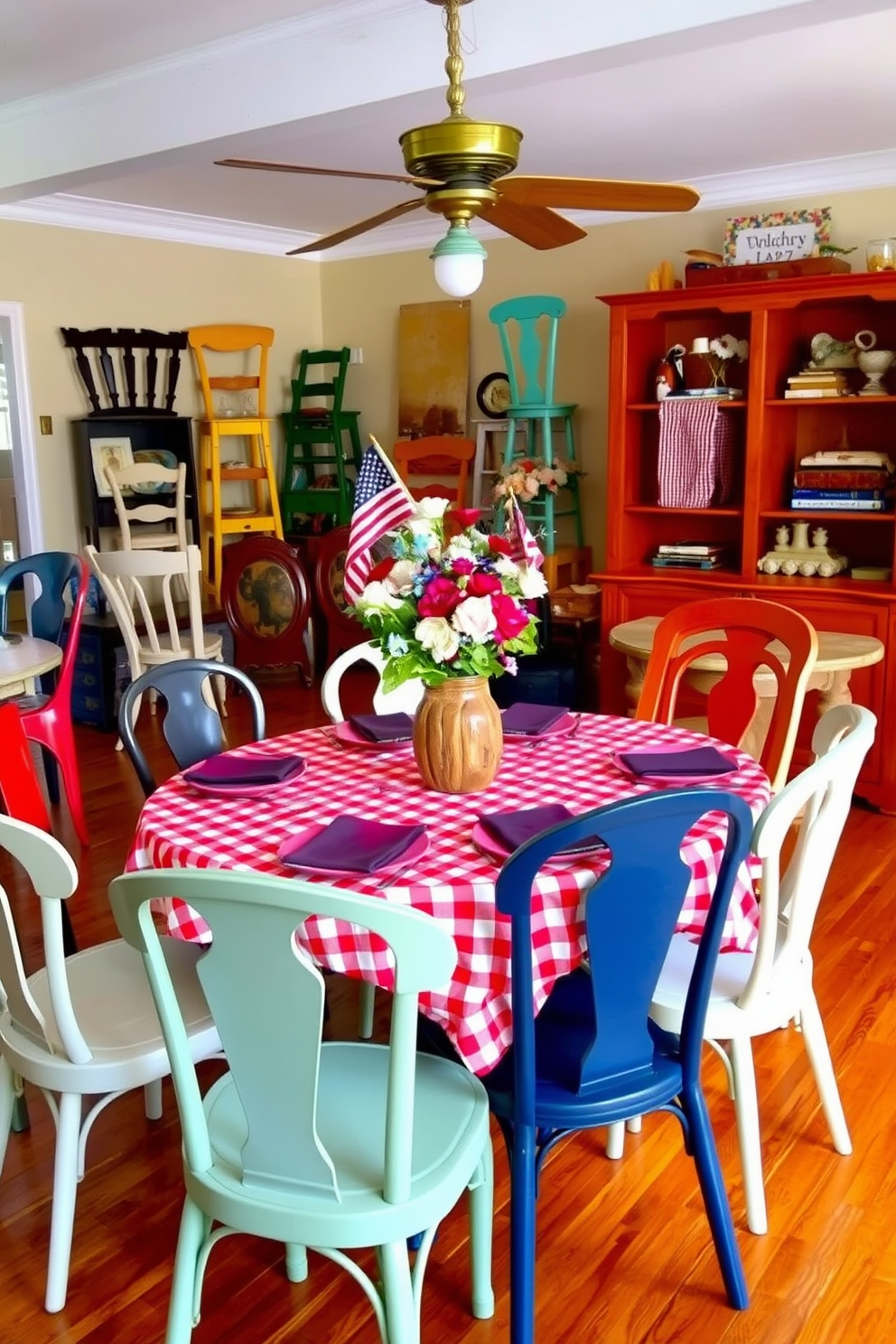 A vibrant dining room filled with an eclectic mix of dining chairs in various colors and styles, creating a playful and inviting atmosphere. The table is set for a festive Labor Day gathering, adorned with a red and white checkered tablecloth and a centerpiece of fresh flowers in a rustic vase.